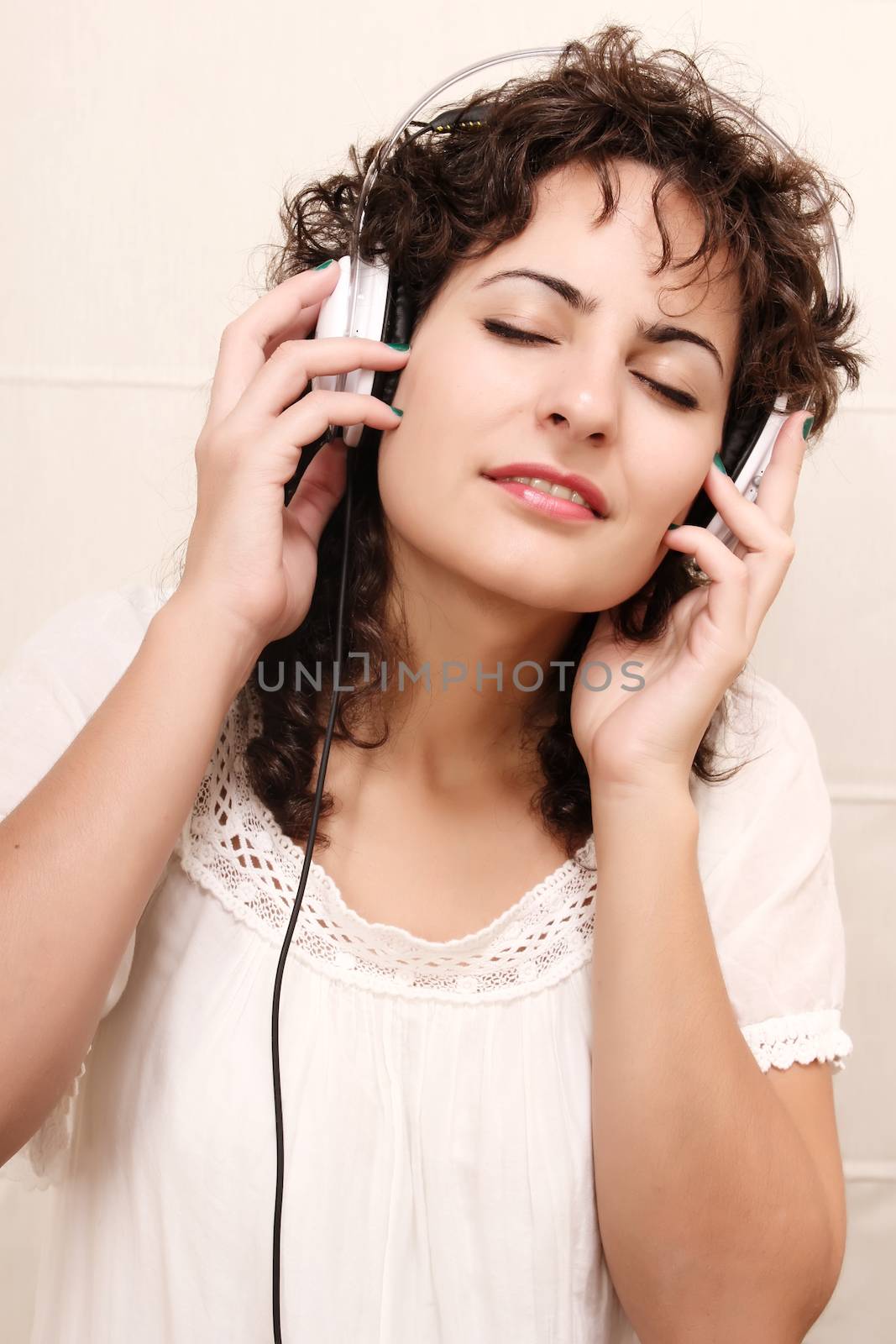 A young woman listening music with Headphones.