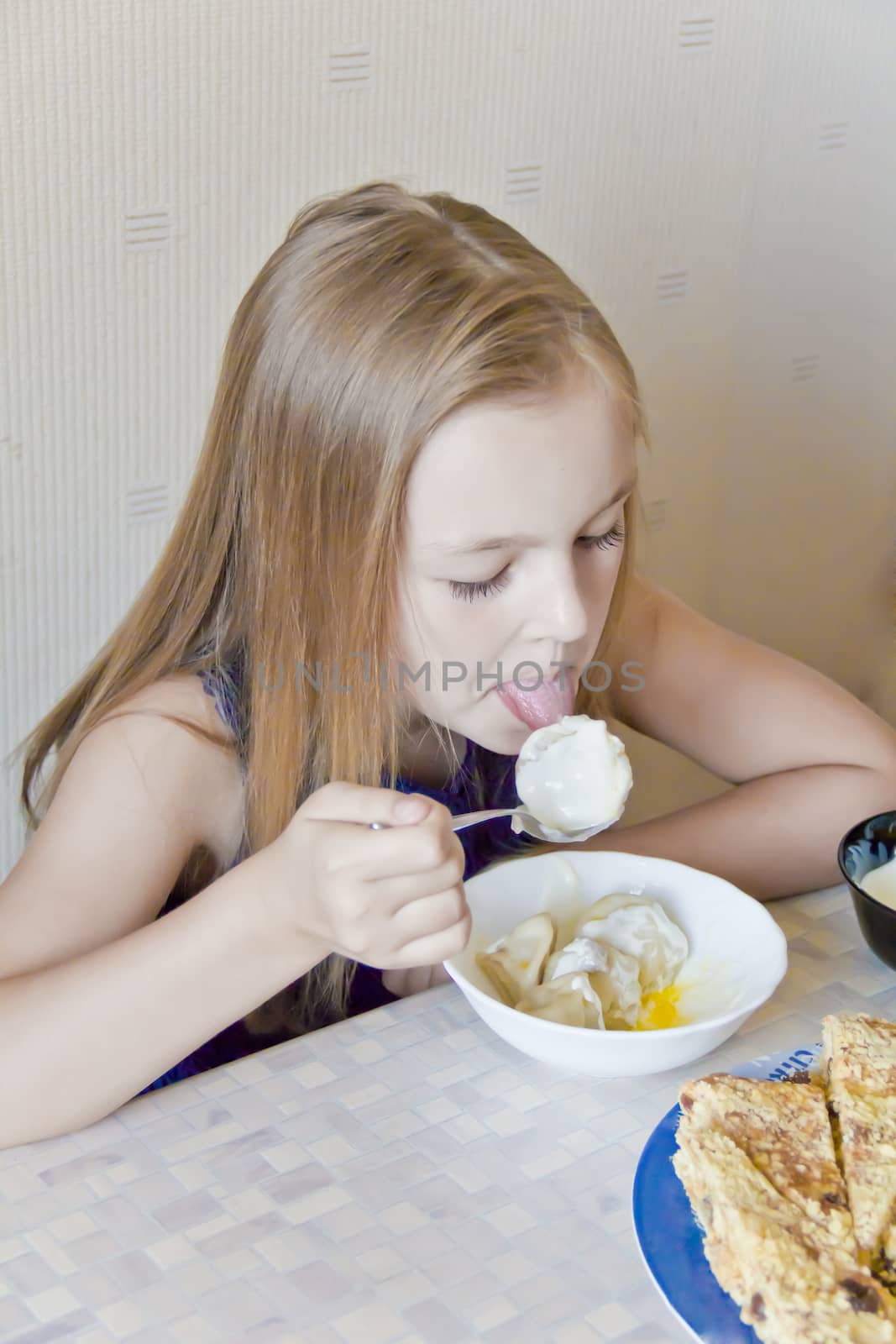Photo of eating cute girl with blond hair