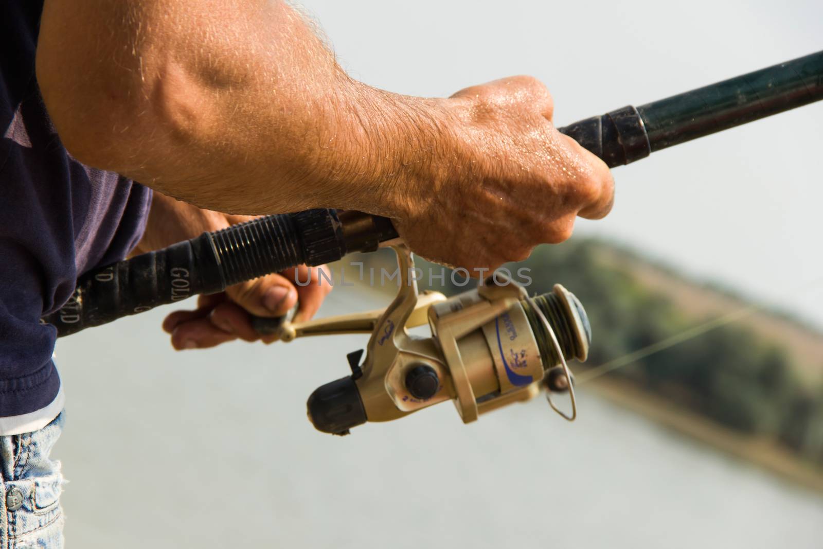 fisherman on the river or a pond for fishing