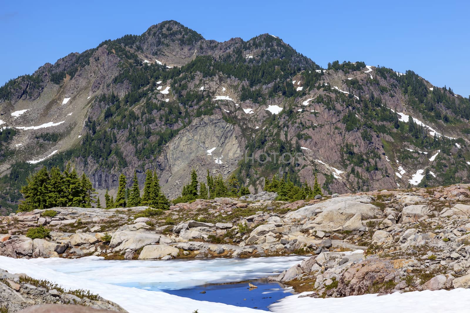 Red Mountains Small Blue Snow Pool Artist Point Washington State by bill_perry