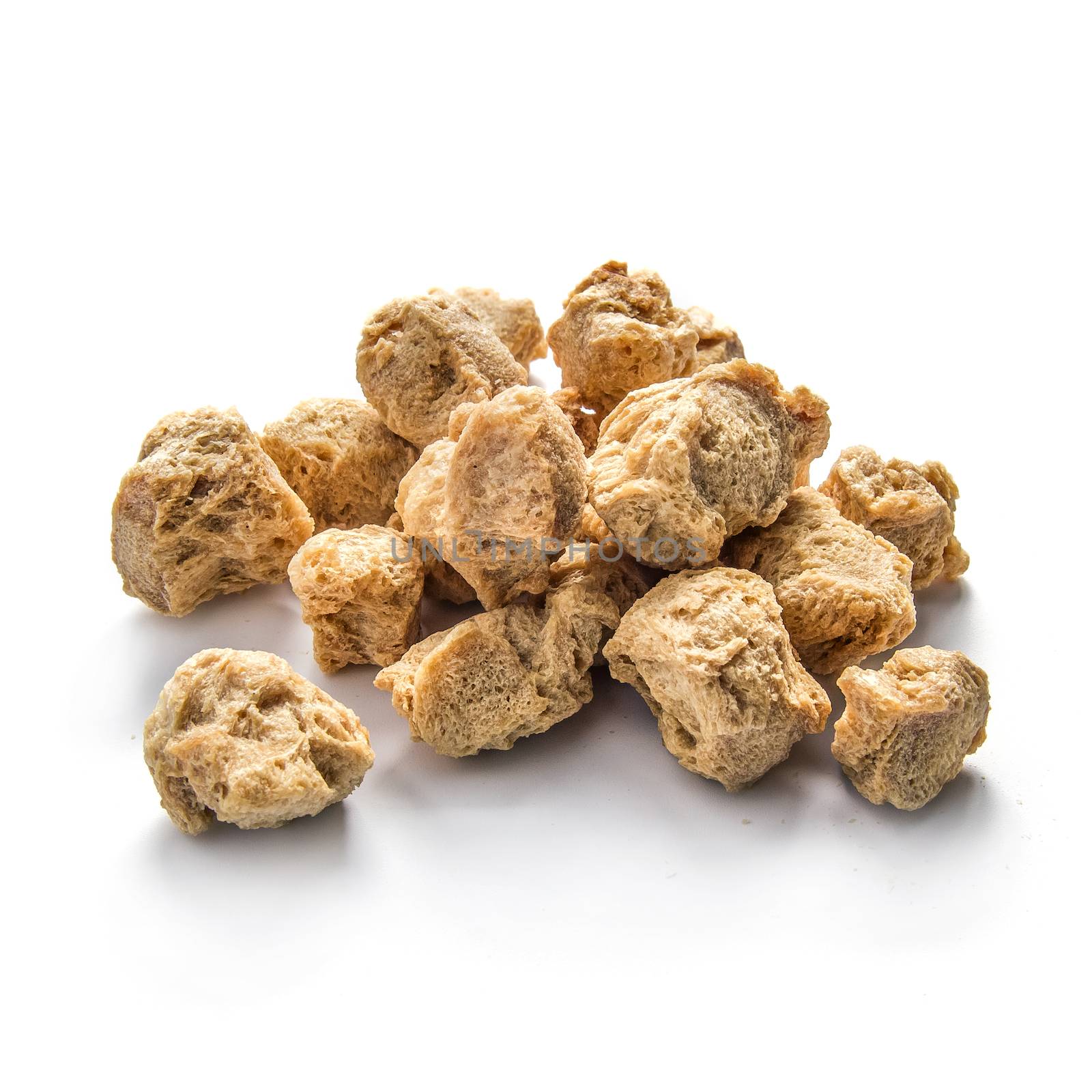 Pile of soy nuggets on white background