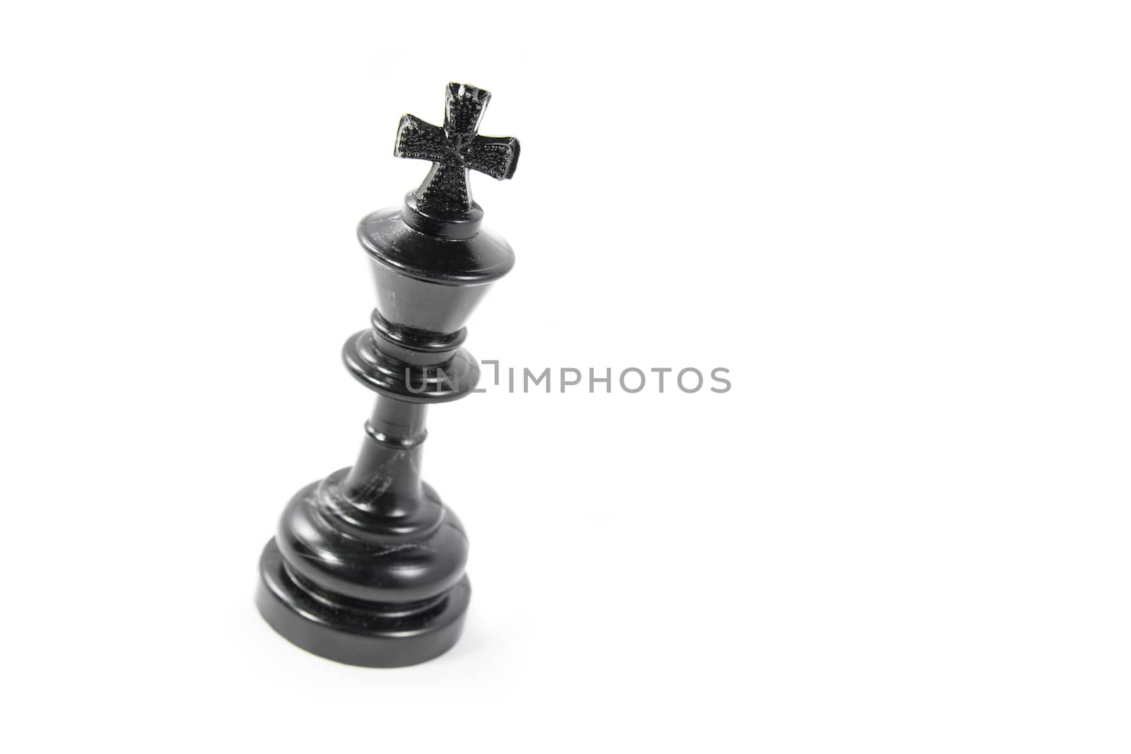 Black chess king isolated on white background