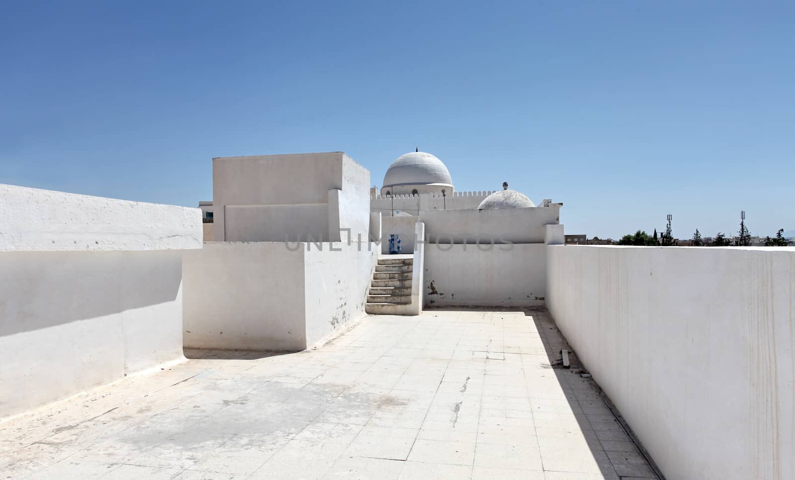 Arab mosque on a background blue sky in tunisia