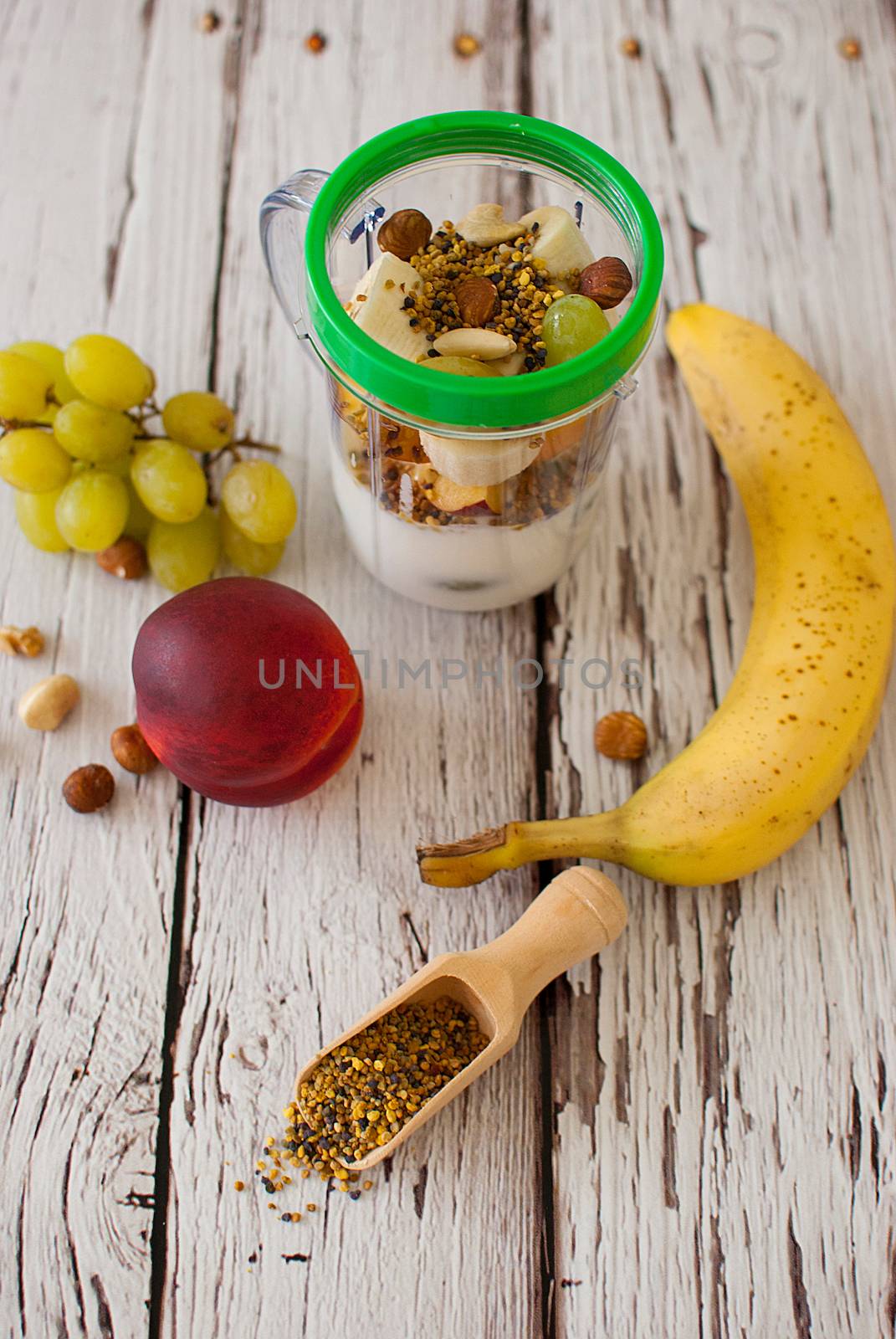 healthy organic fruit and nuts smoothie on wooden board