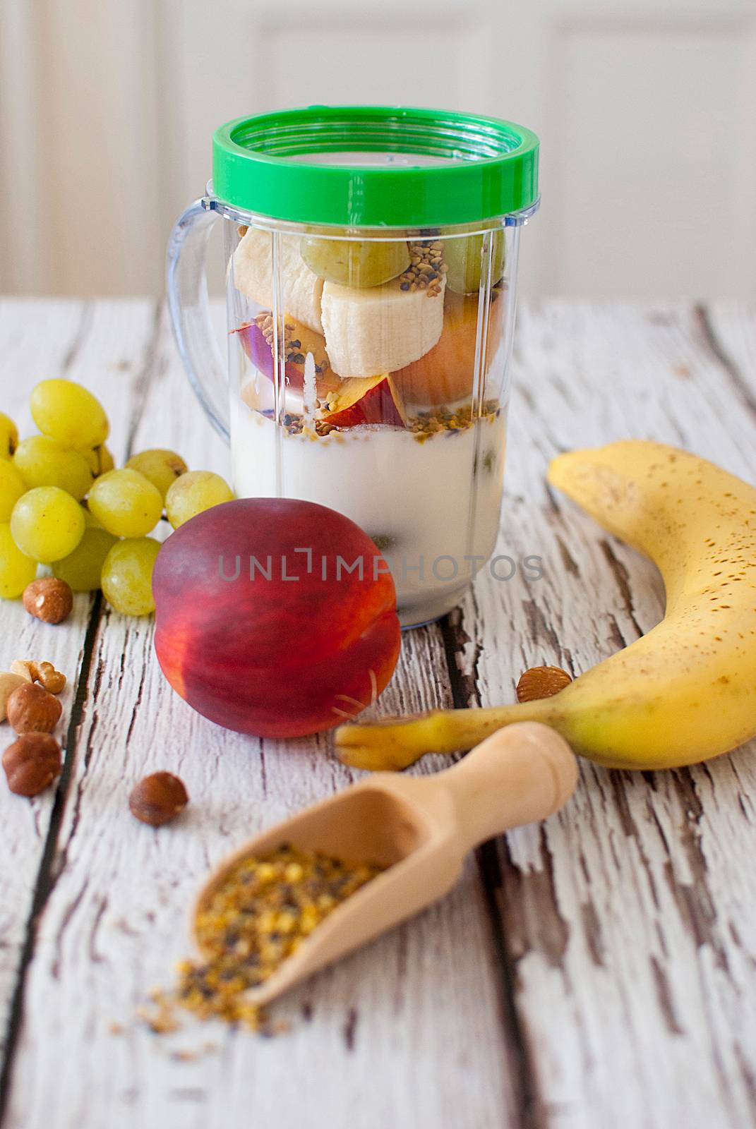 healthy organic fruit and nuts smoothie on wooden board