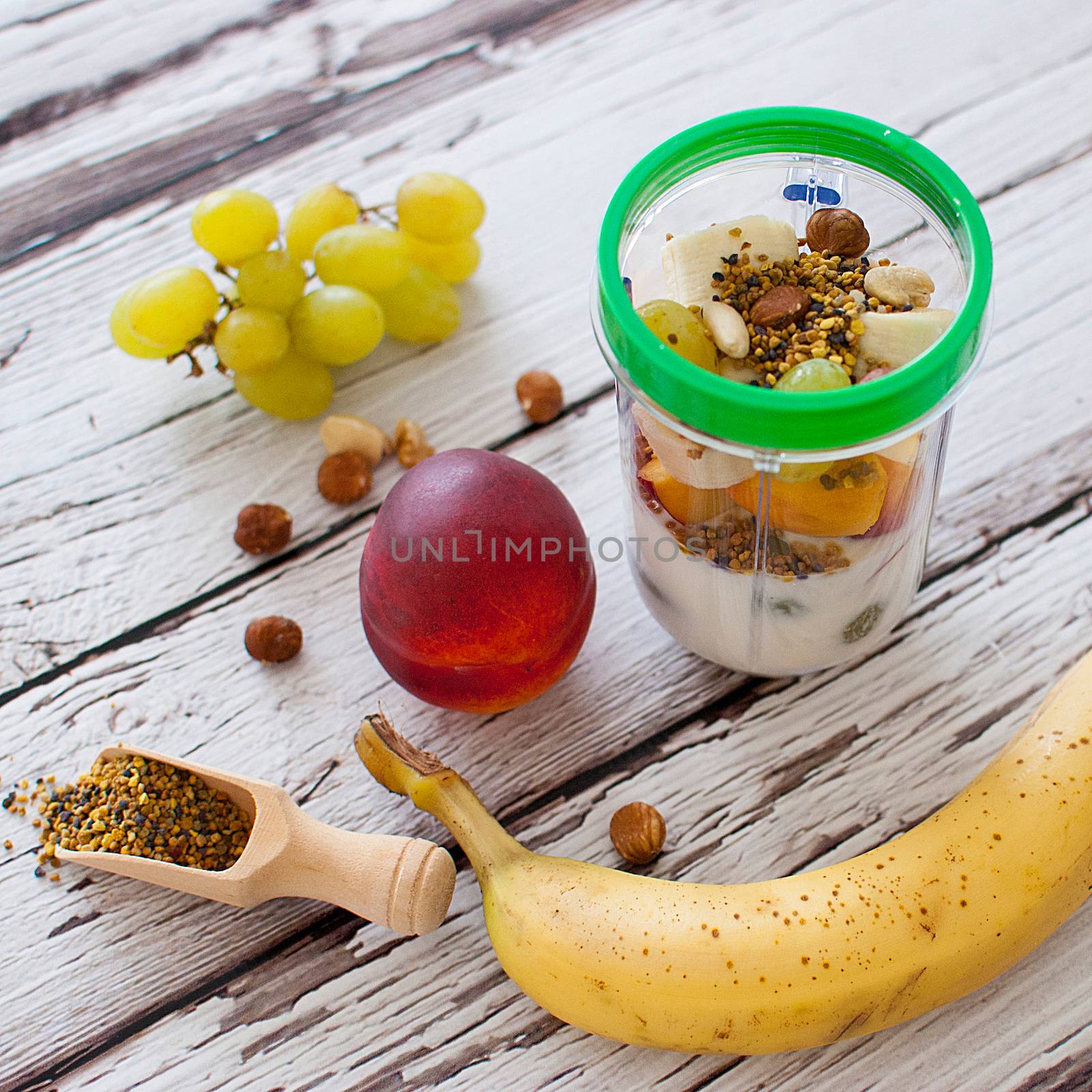 healthy organic fruit and nuts smoothie on wooden board