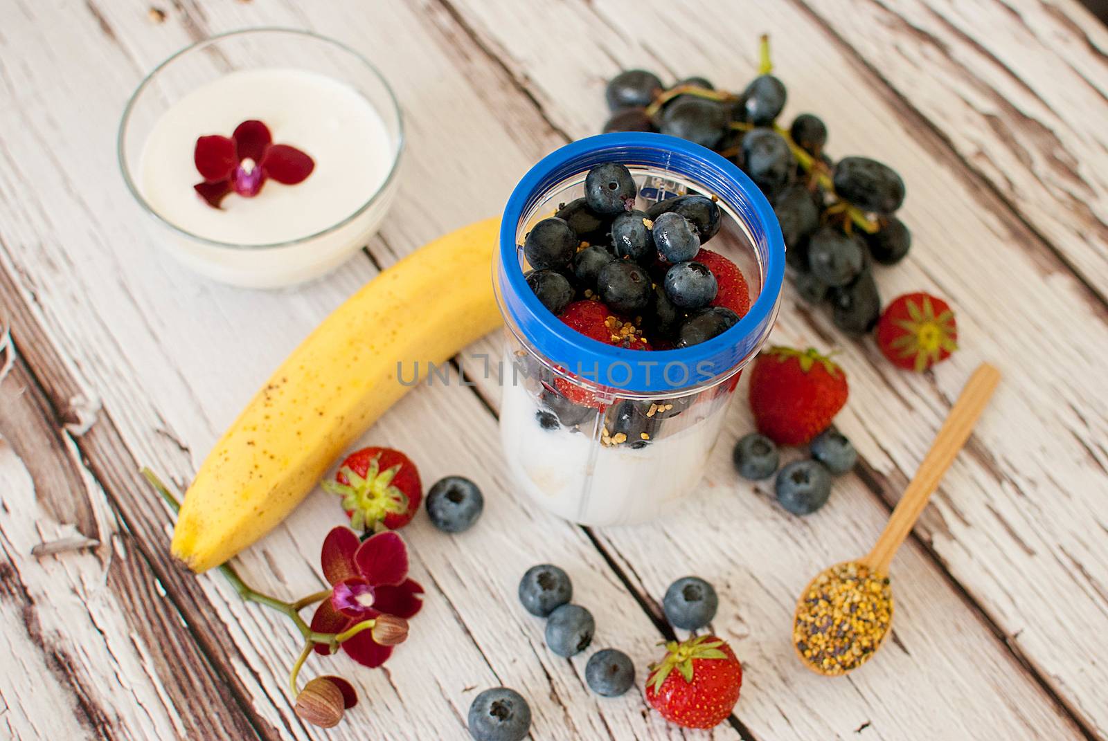 healthy organic fruit and nuts smoothie on wooden board