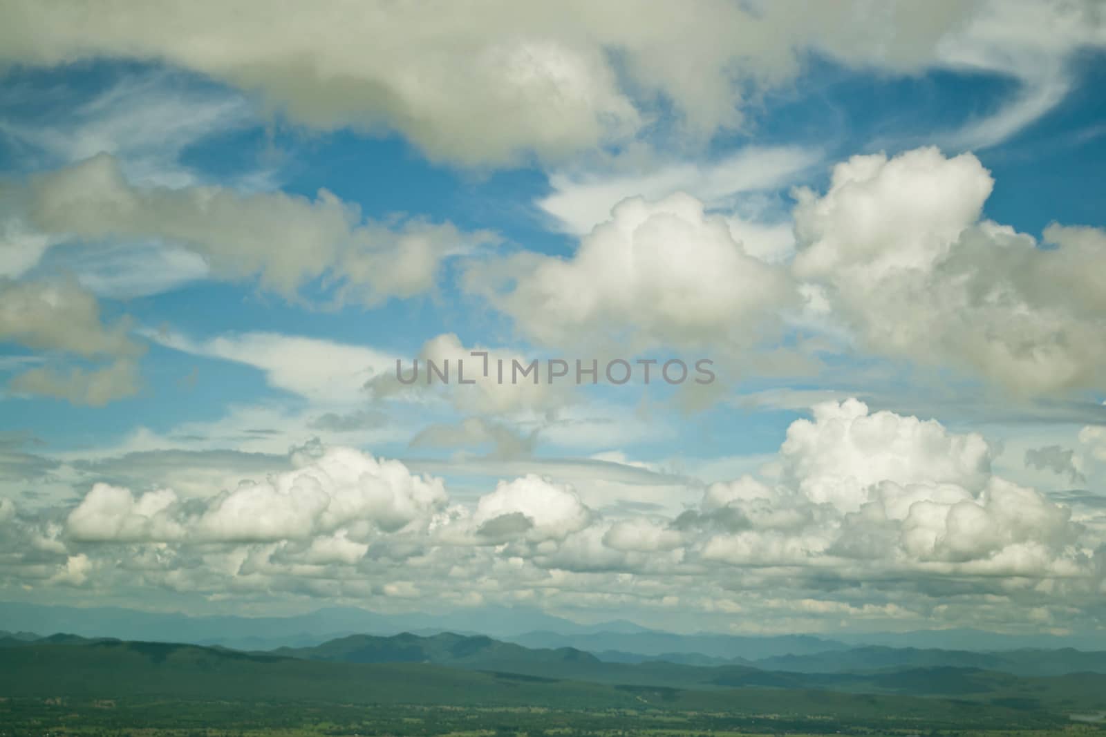 Mountains green grass and blue sky landscape 