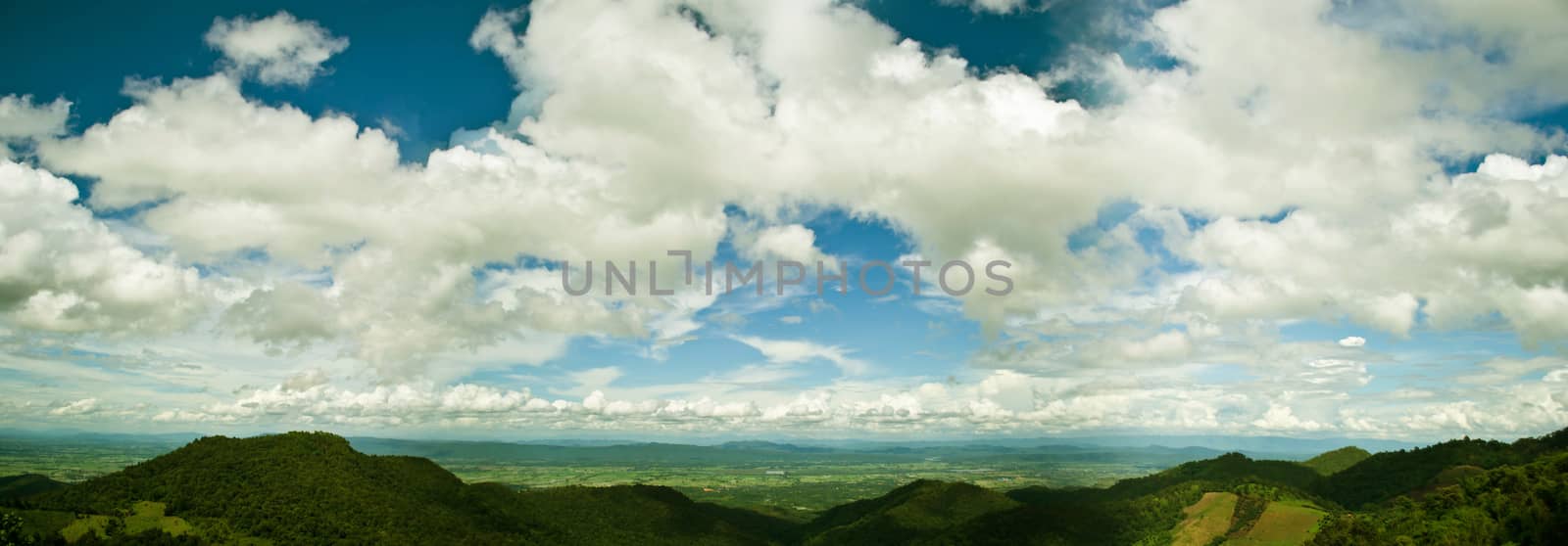 mountains green grass and blue sky landscape by Thanamat