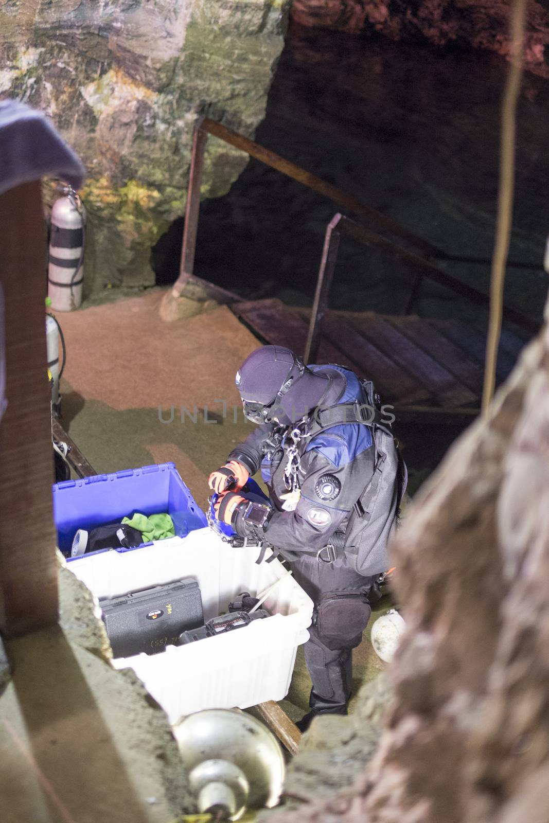 OURO PRETO, BRAZIL - JULY 27: Man prepares to dive into the Passage Mines lake. The mines connect two cities, and the underground lake reaches 240 meters at its deepest. July 27, 2014 in Ouro Preto.
