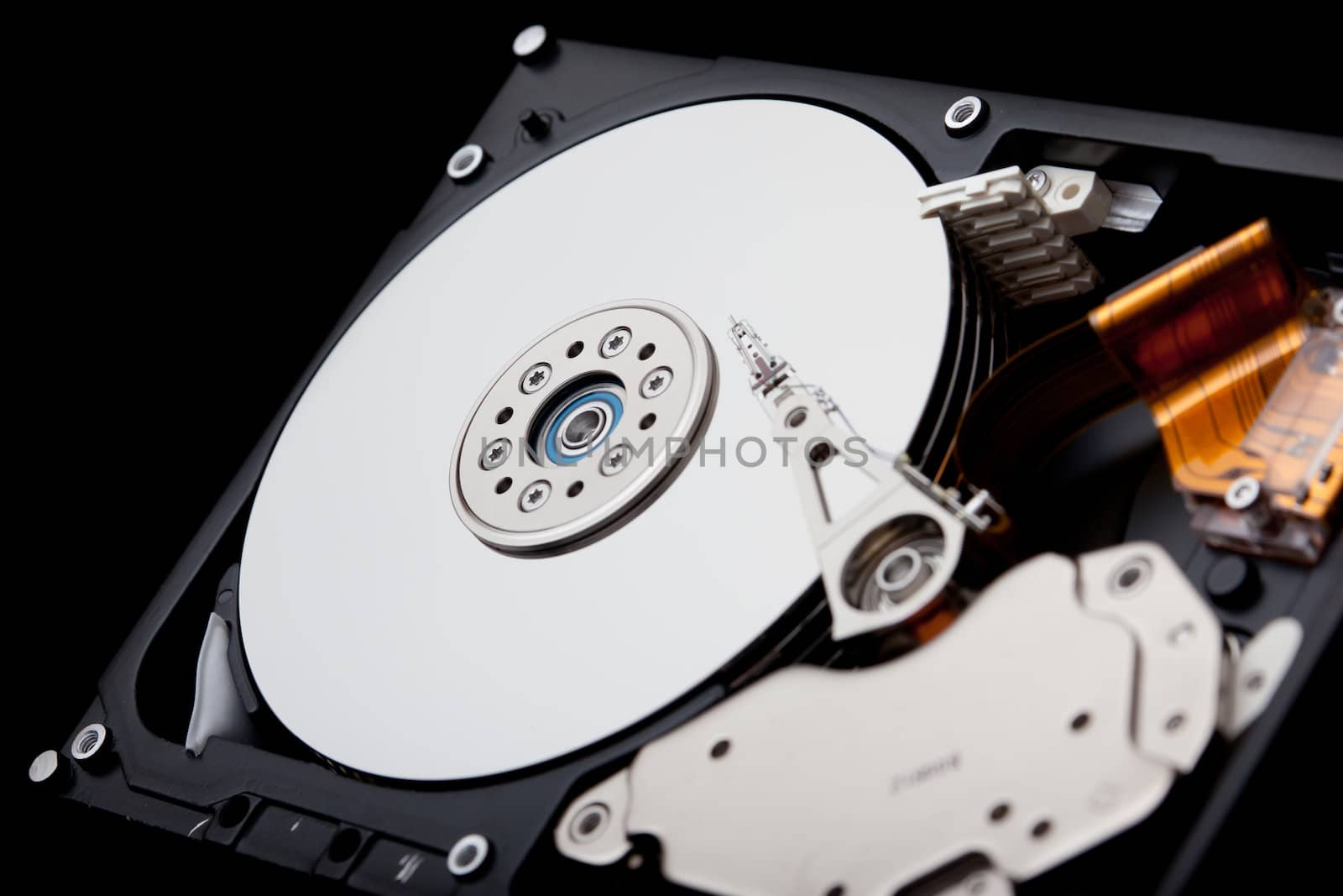 an opened hard disk on black background