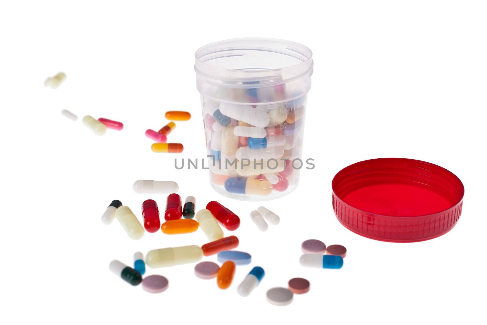 A lot of colored pills and tablets over a white background