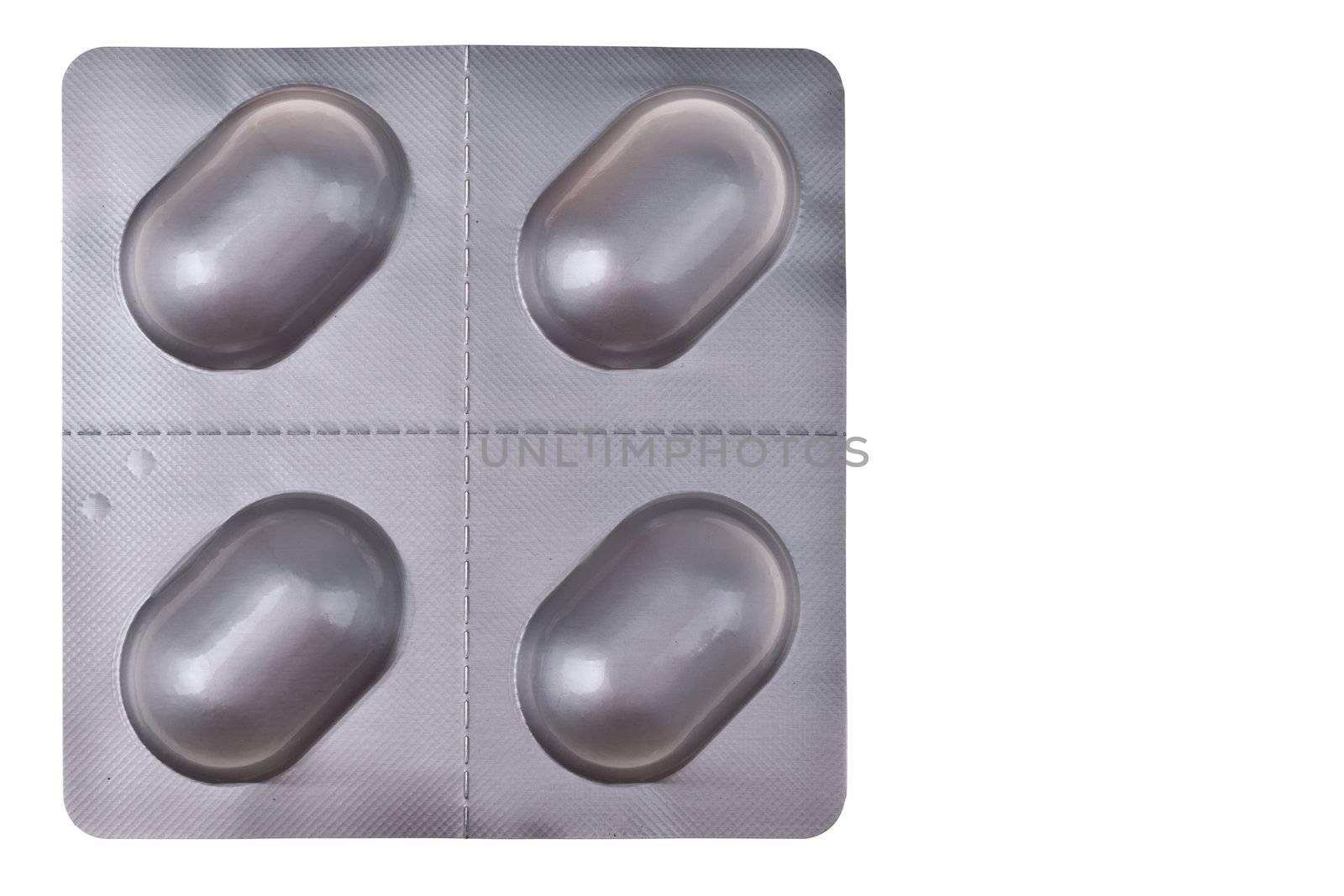 a blister of pills over a white background