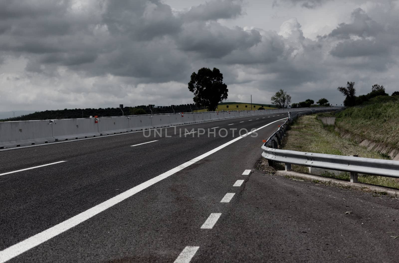 Highway under stormy sky