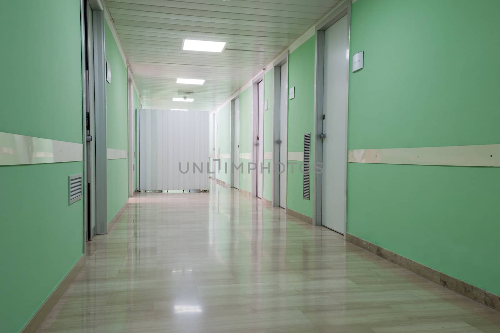 an empty Ospital ward with green walls