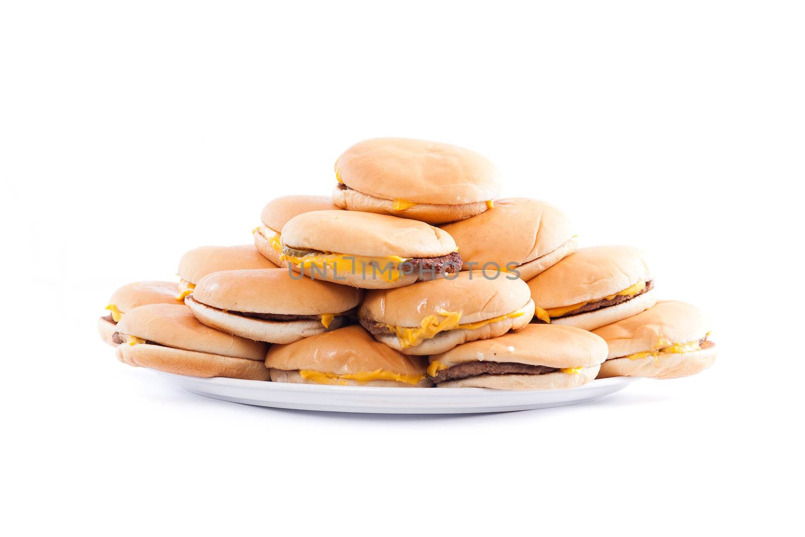 A plate full of cheesburgers isolated on a white background