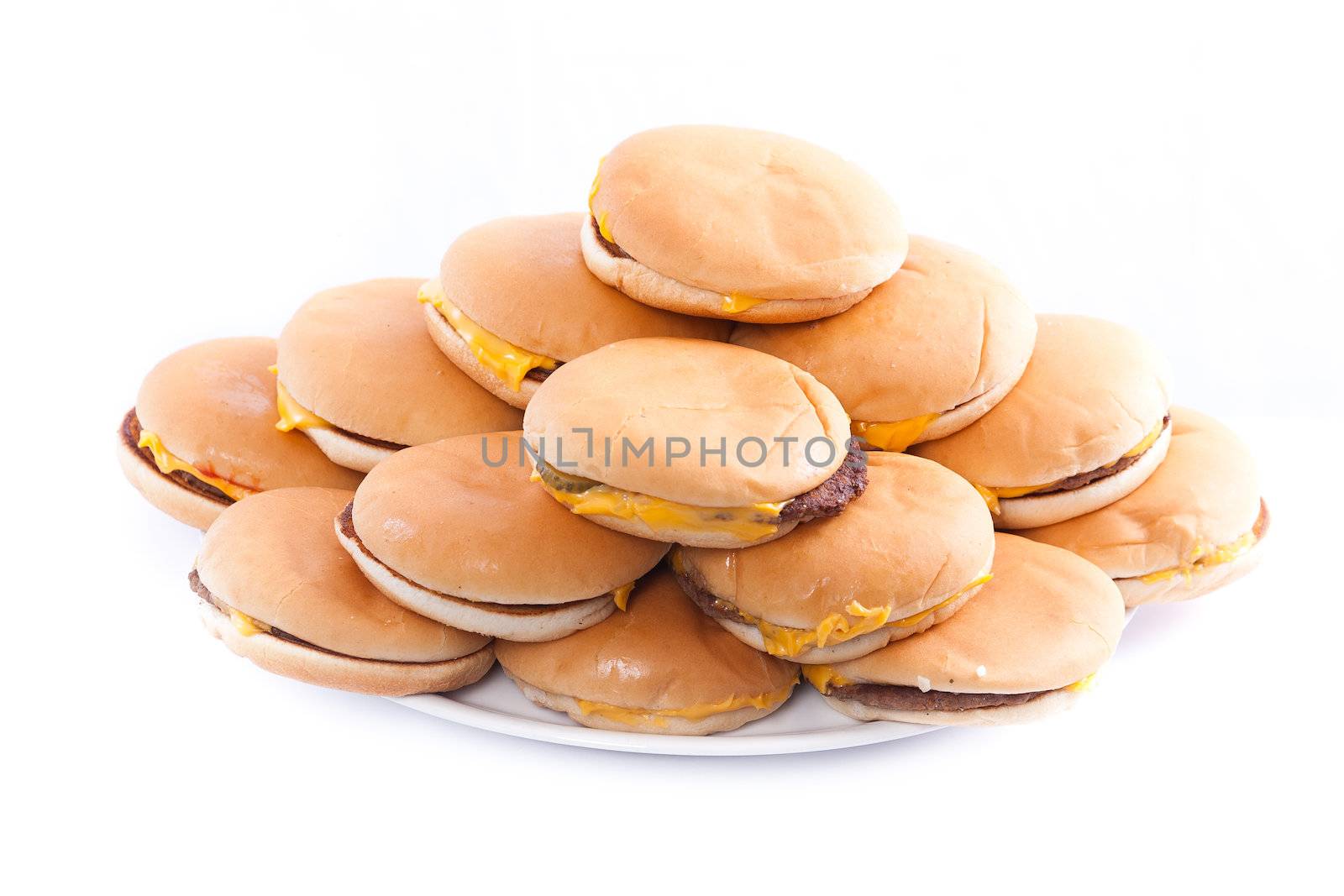 A plate full of cheesburgers isolated on a white background