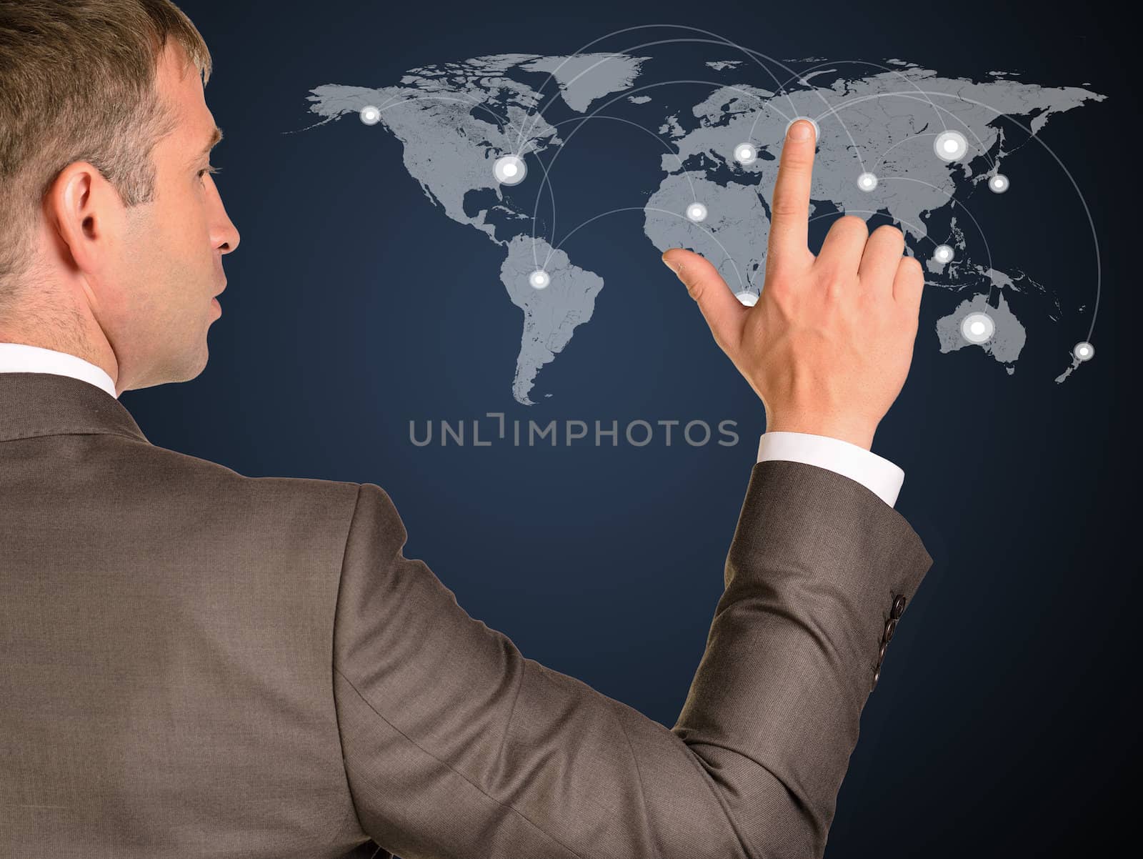 Businessman in a suit presses the virtual world map with contacts. The concept of global contacts