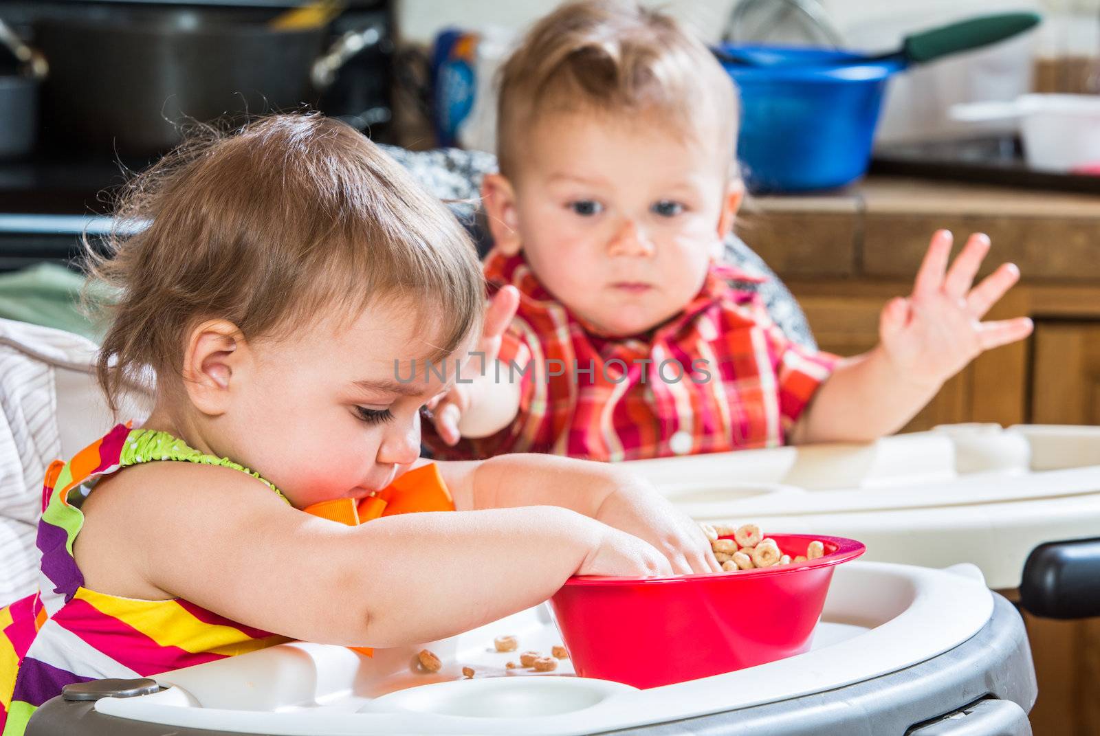 Two Babies Eat Breakfast by Creatista