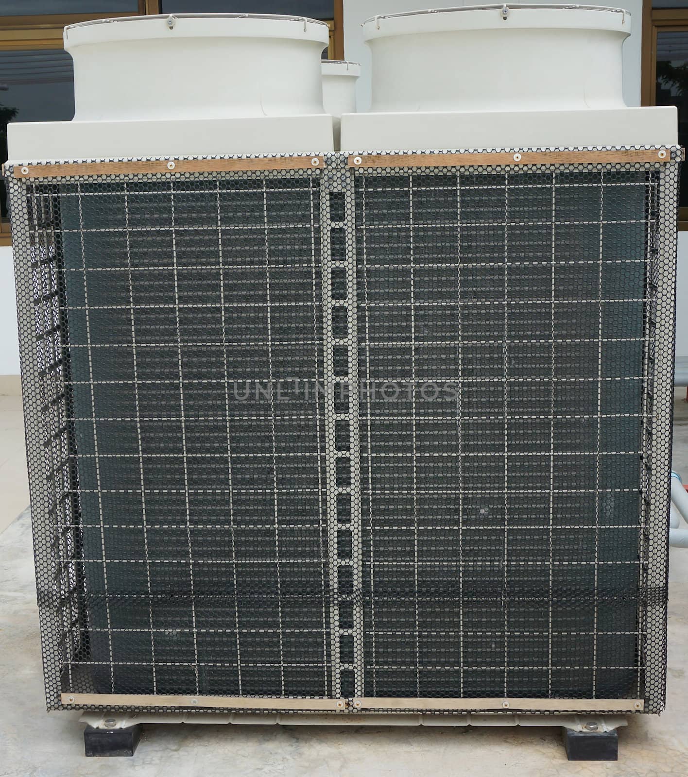 Air conditioner compressor units, shape of a rectangle shape, have steel grid cover exterior part.                              