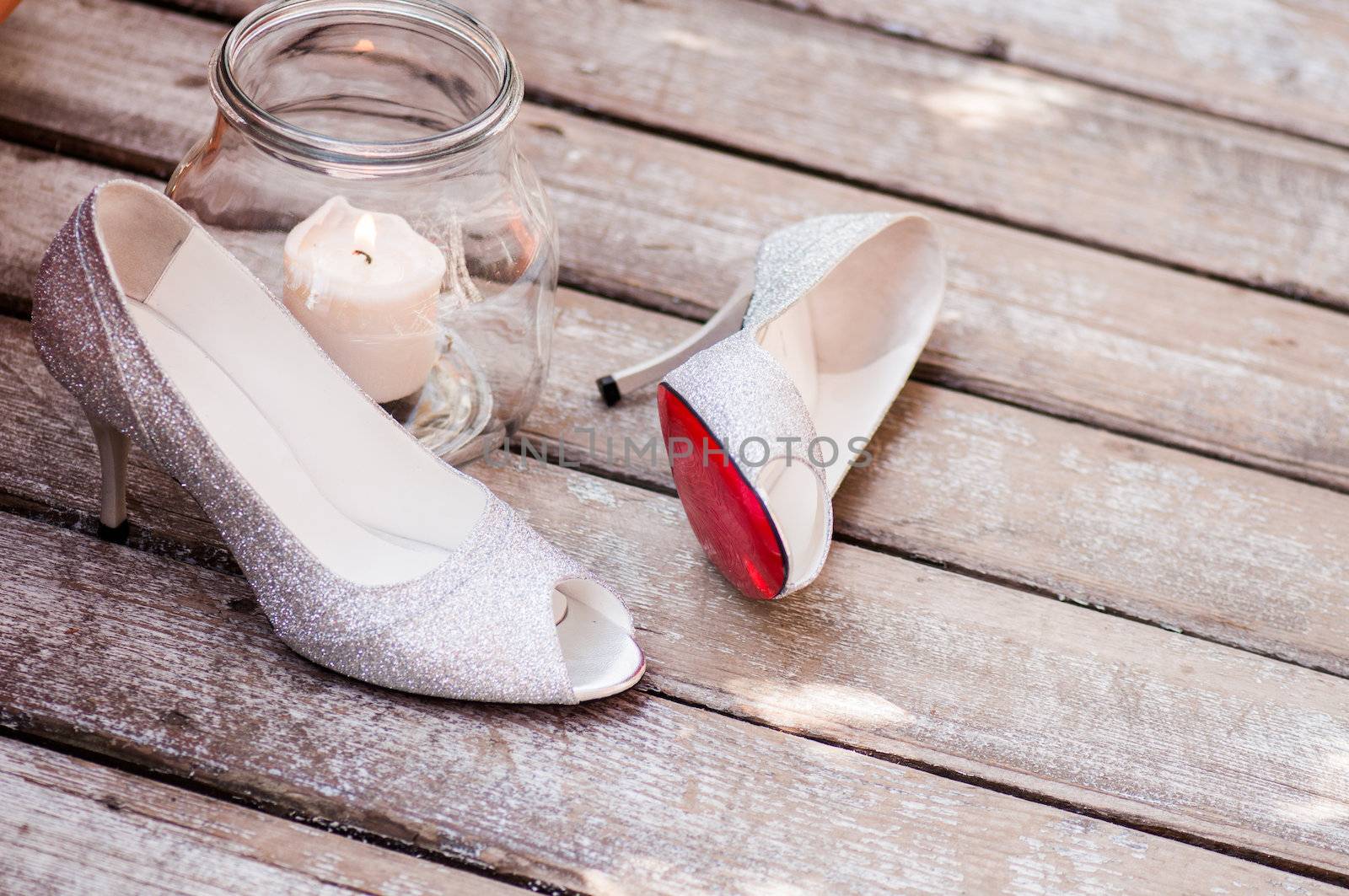 Woman glamour shoes isolated on wood texture