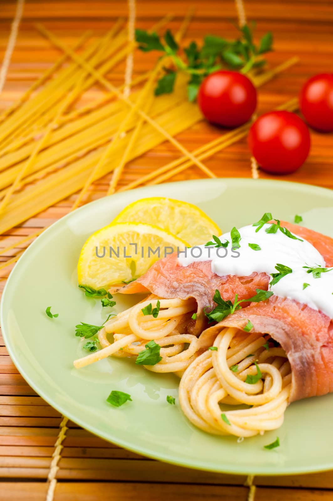 Delicious pasta with somon and tomatoes by marius_dragne