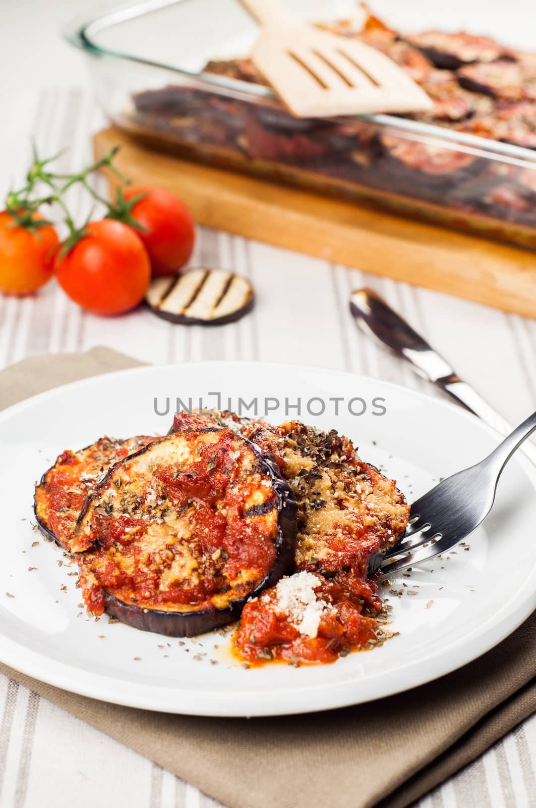 Delicious parmigiana on white plate by marius_dragne