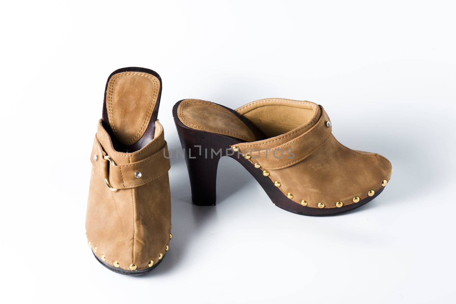 Woman brown shoes on white background