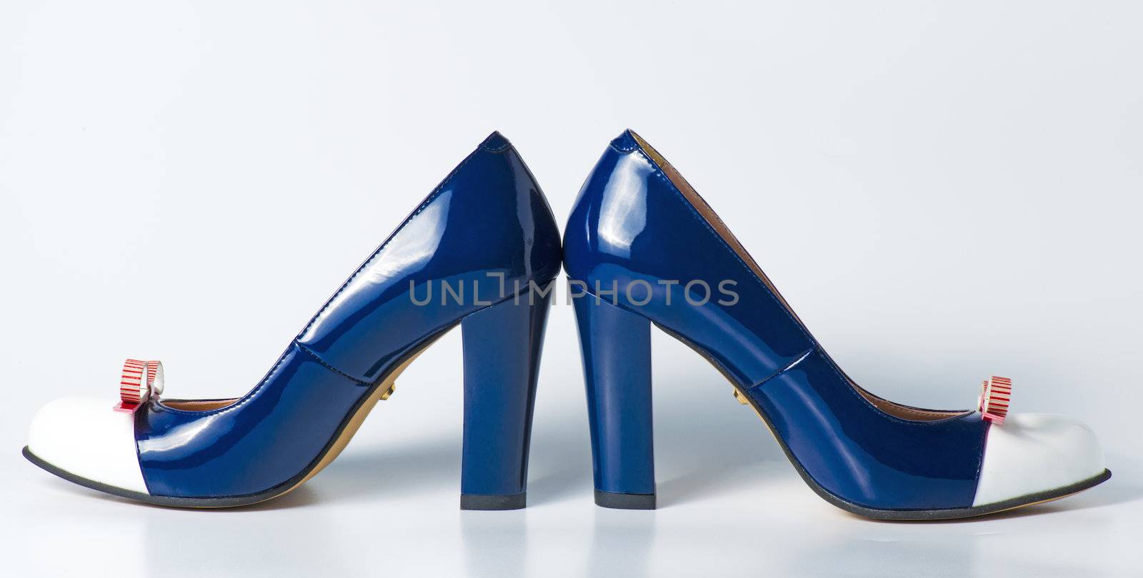 Woman blue shoes on white background