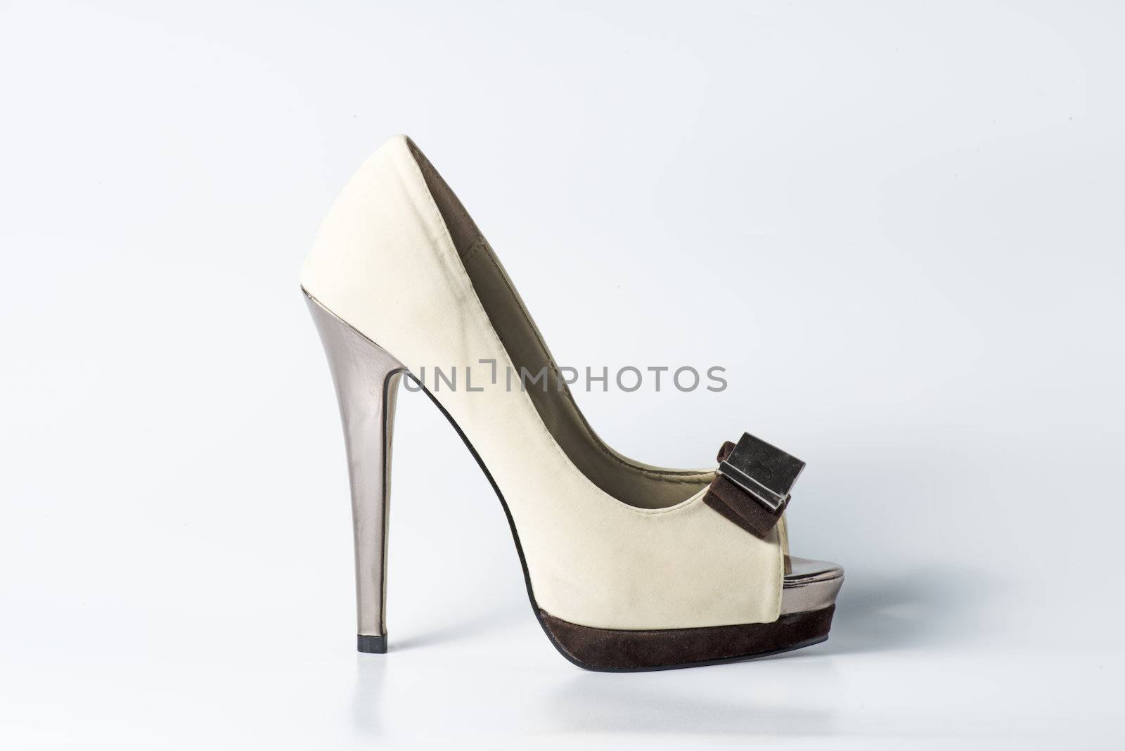Woman beige shoes on white background
