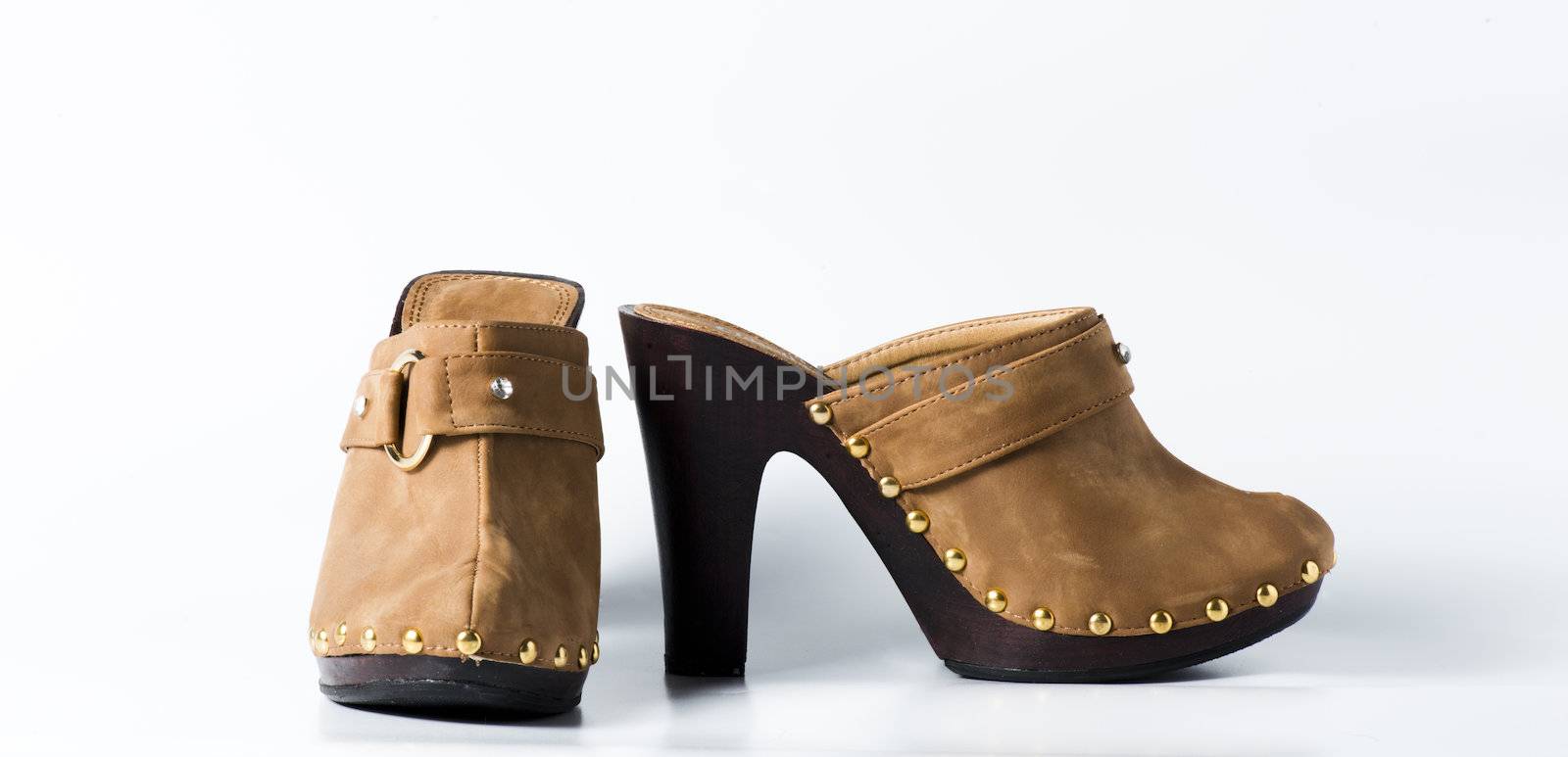 Woman brown shoes on white background