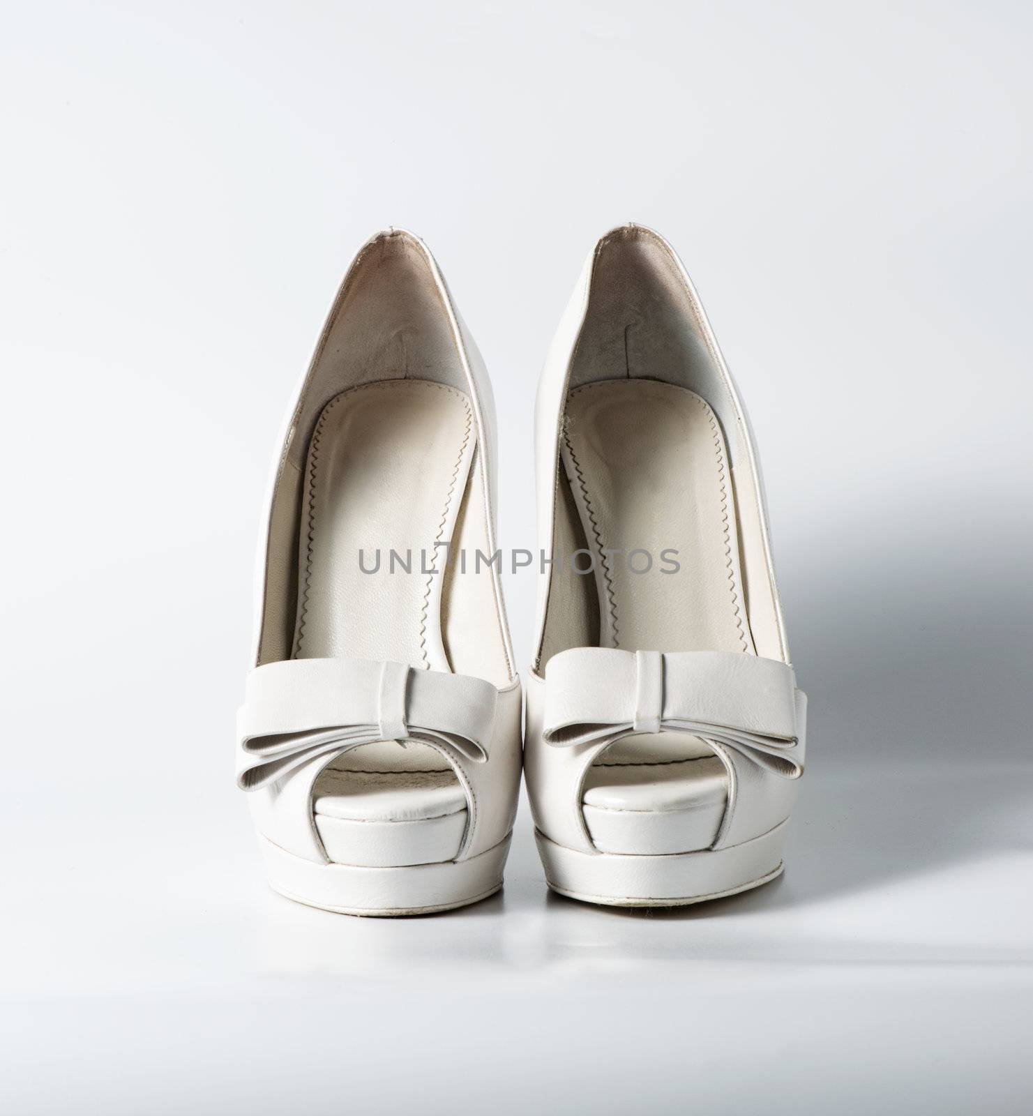 Woman white shoes on white background