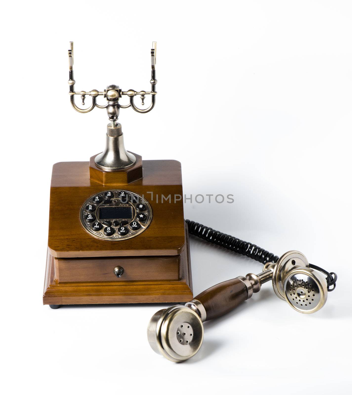Old wooden phone on white by marius_dragne