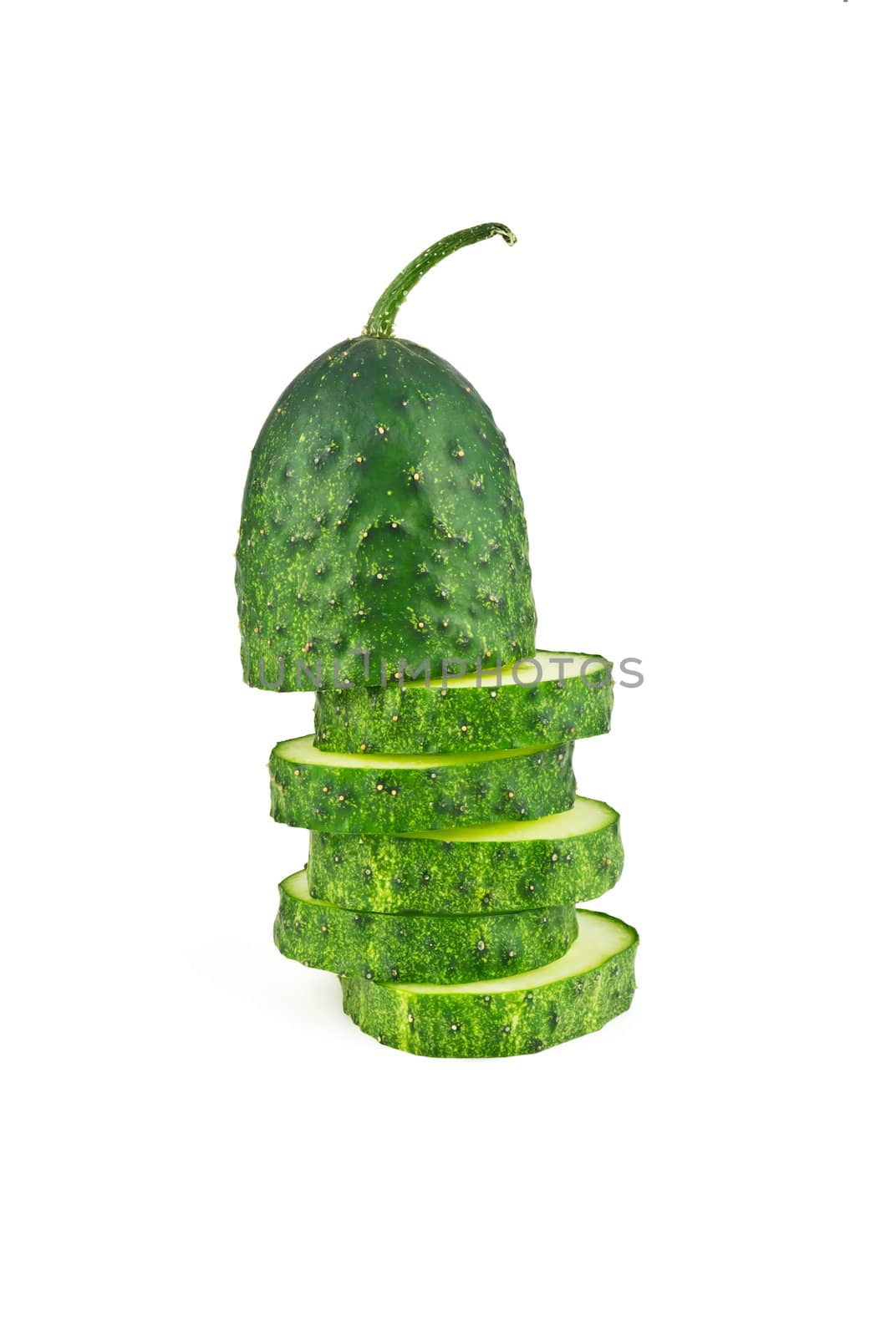 Slices of cucumber in the form of uneven pillar on a white background