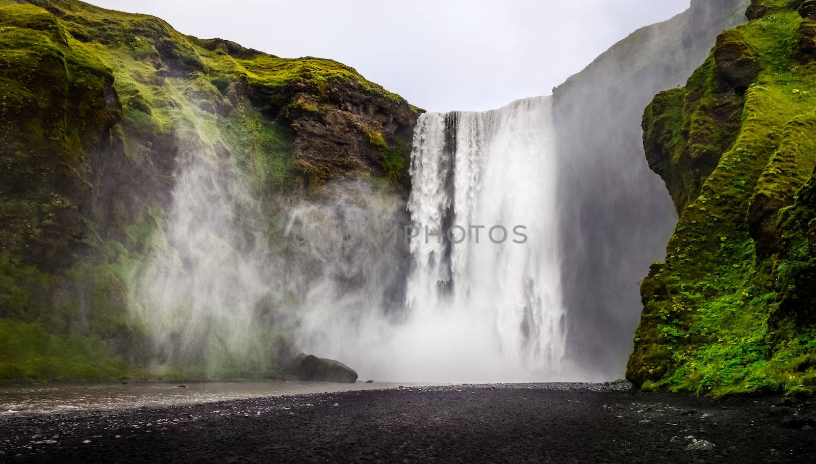 Landscape view of wild Skogafoss waterfall near Skogar, Iceland