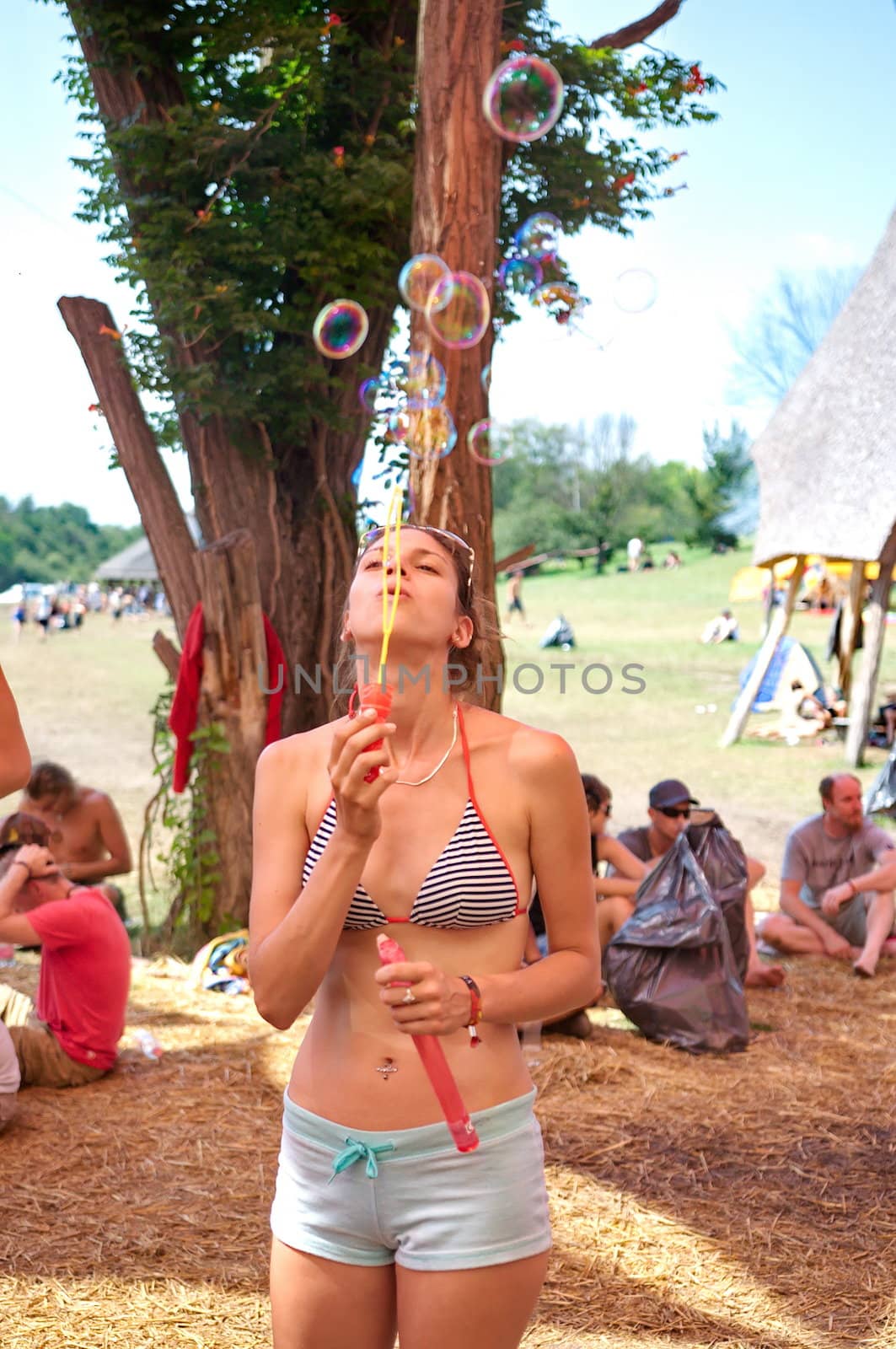 OZORA, HUNGARY - AUGUST 01: Girl blowing bubles on Ozora Festiva by anderm