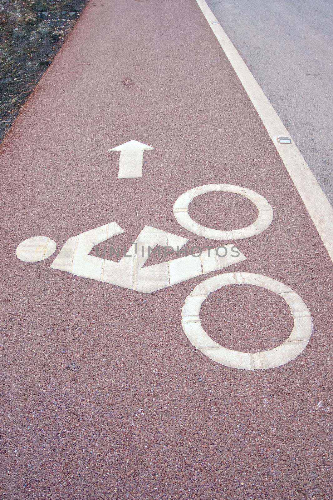 Sign of bicycle lane beside the road by eaglesky