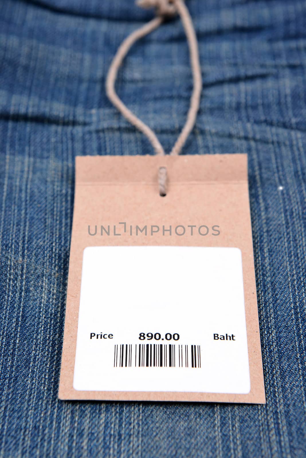 price tag with barcode on  jeans by anankkml