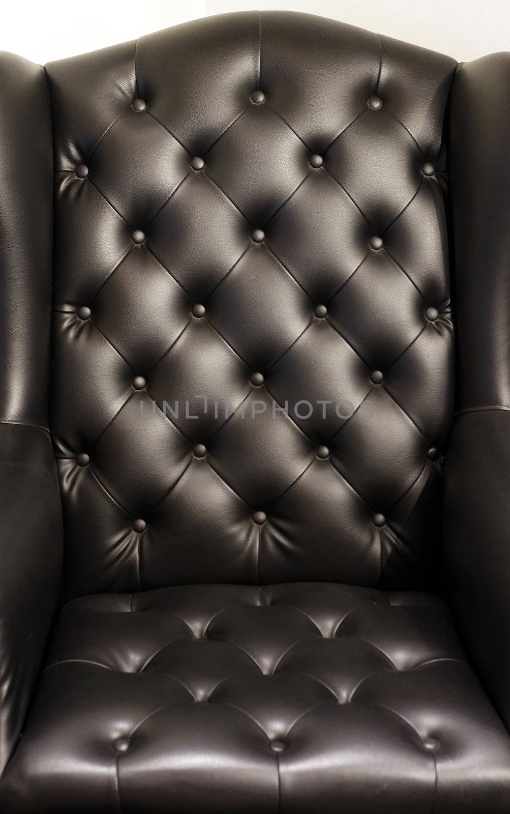 Black genuine leather armchair, luxury furniture