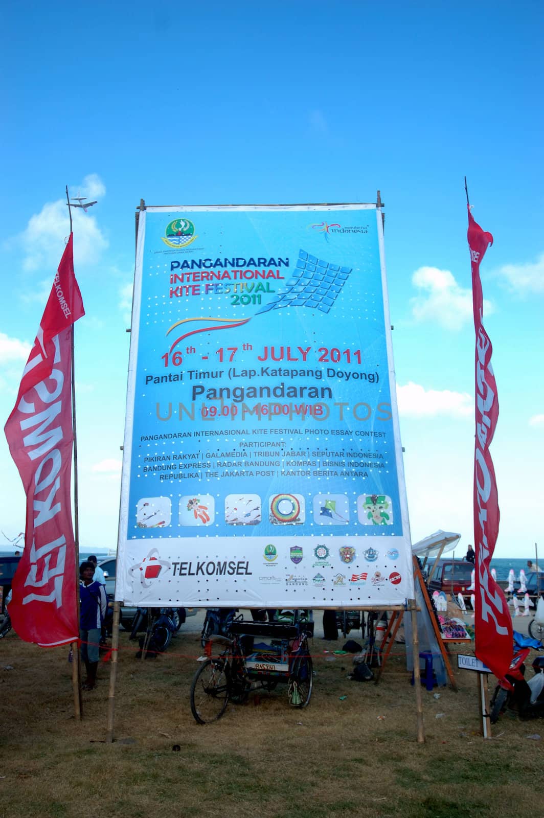 pangandaran, indonesia-july 16, 2011: pangandaran international kite festival billboard that held in east coast pangandaran beach, west java-indonesia.