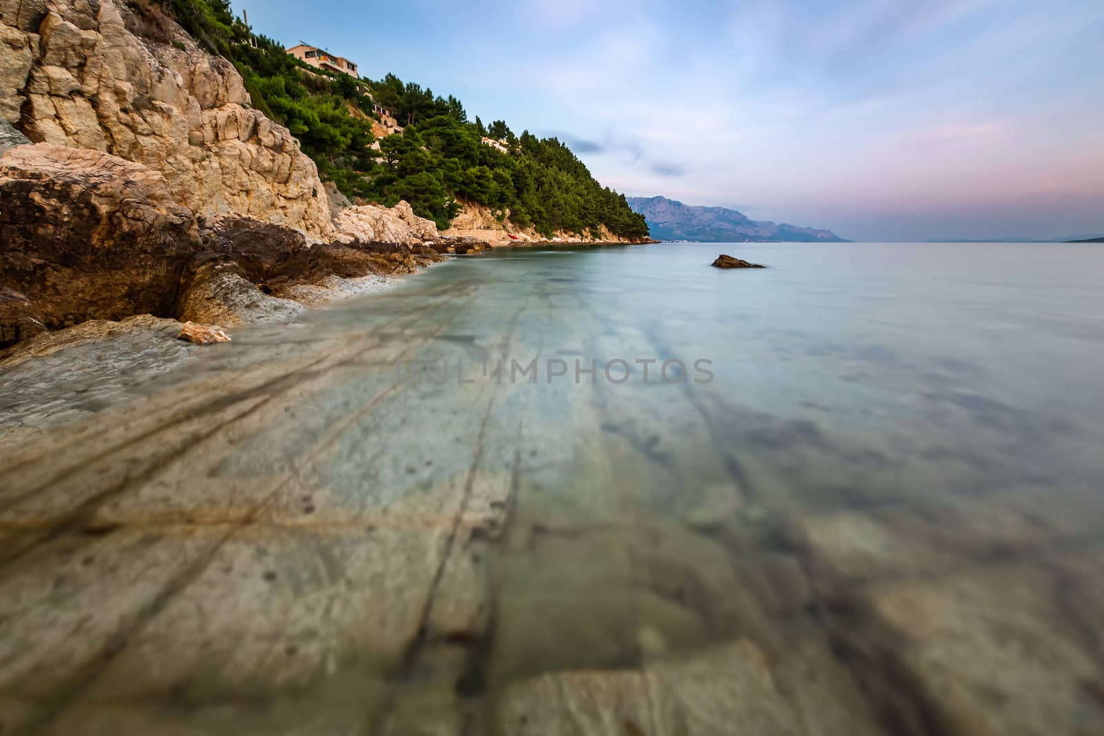 Rocky Beach and Transparent Adriatic Sea near Omis in the Evening, Dalmatia, Croatia