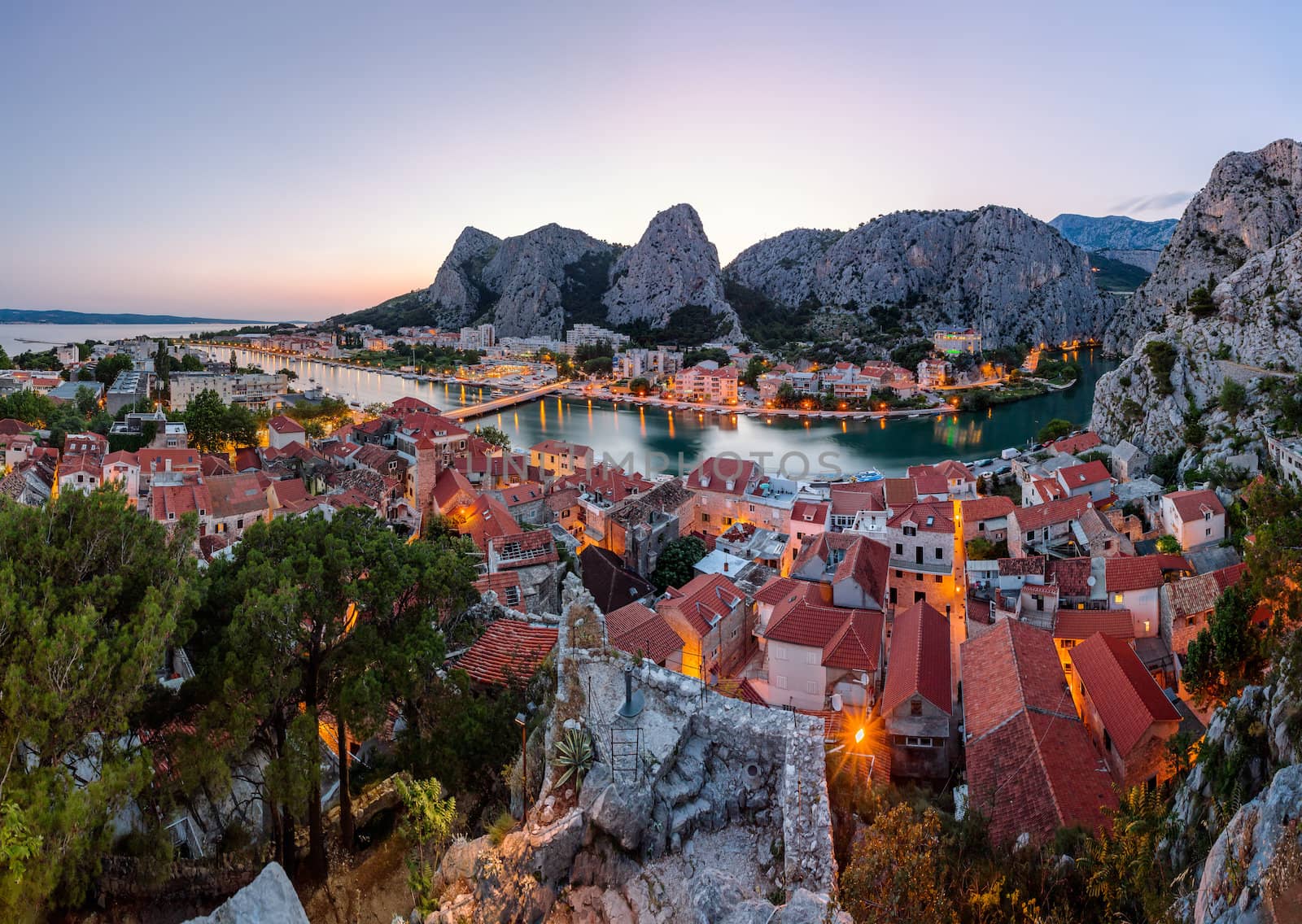 Aerial Panorama of Omis and Cetina River Gorge in the Evening, D by anshar