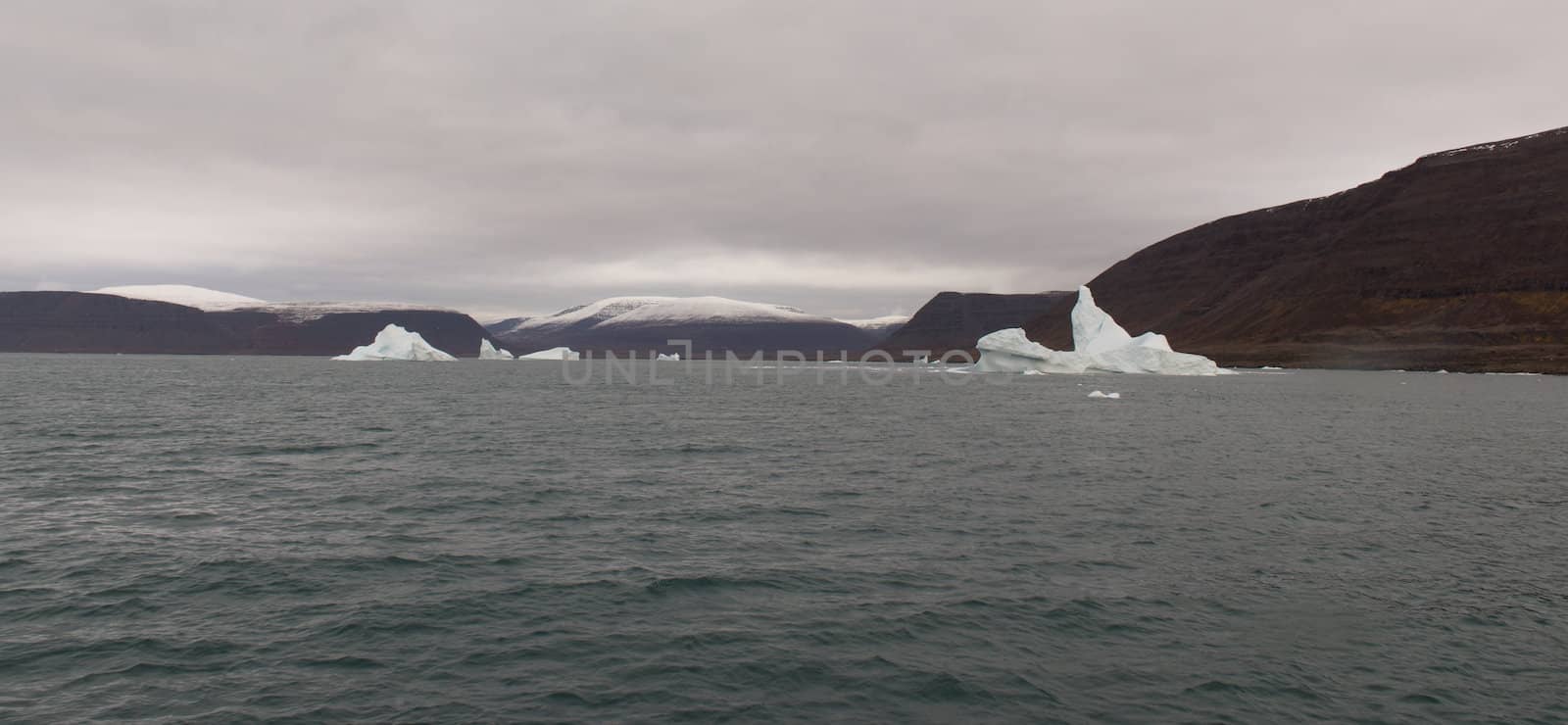 Arctic landscape in Greenland around Disko Island with dramatic sky