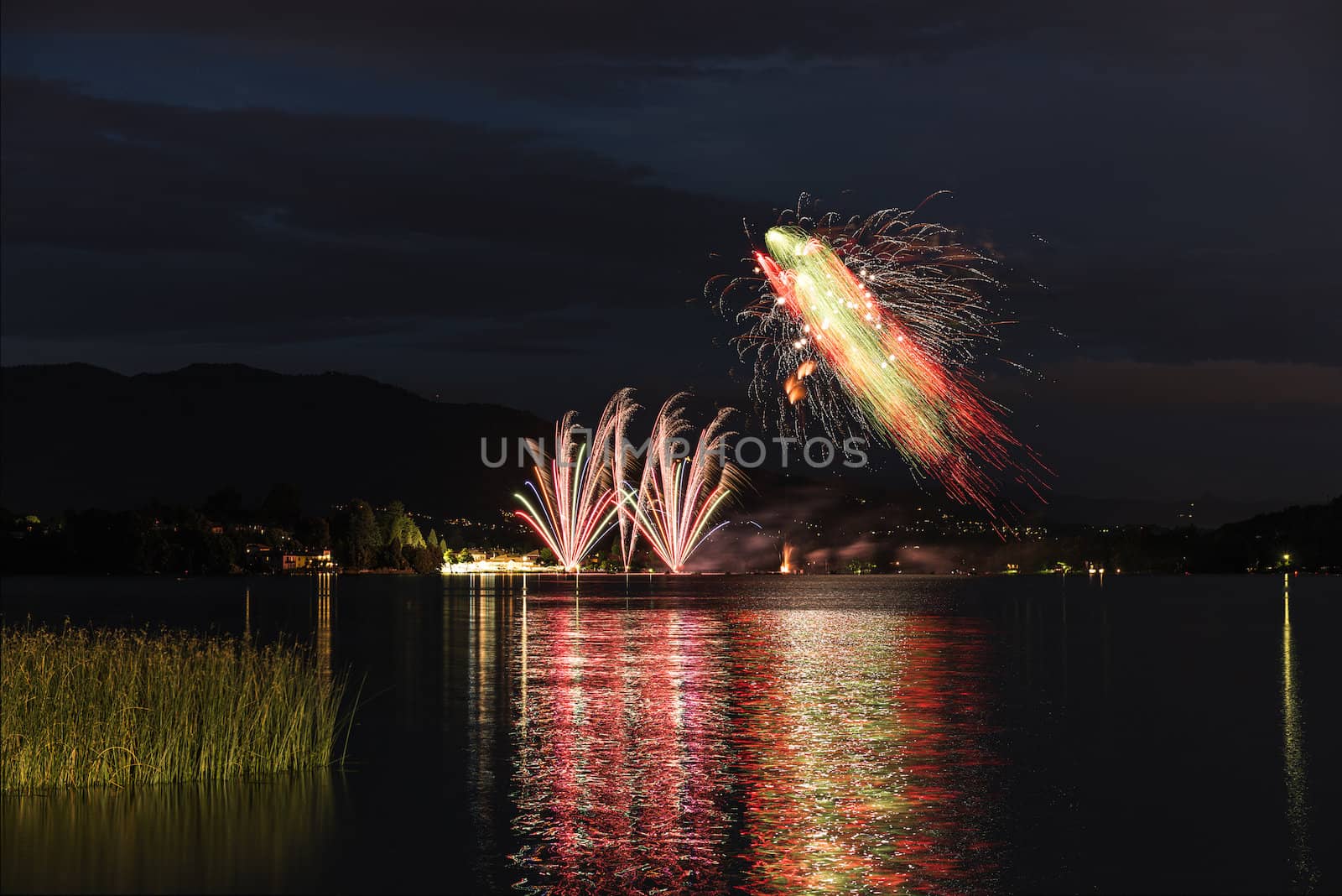 Fireworks on the lakefront of Travedona Monate in a summer party, Lombardy