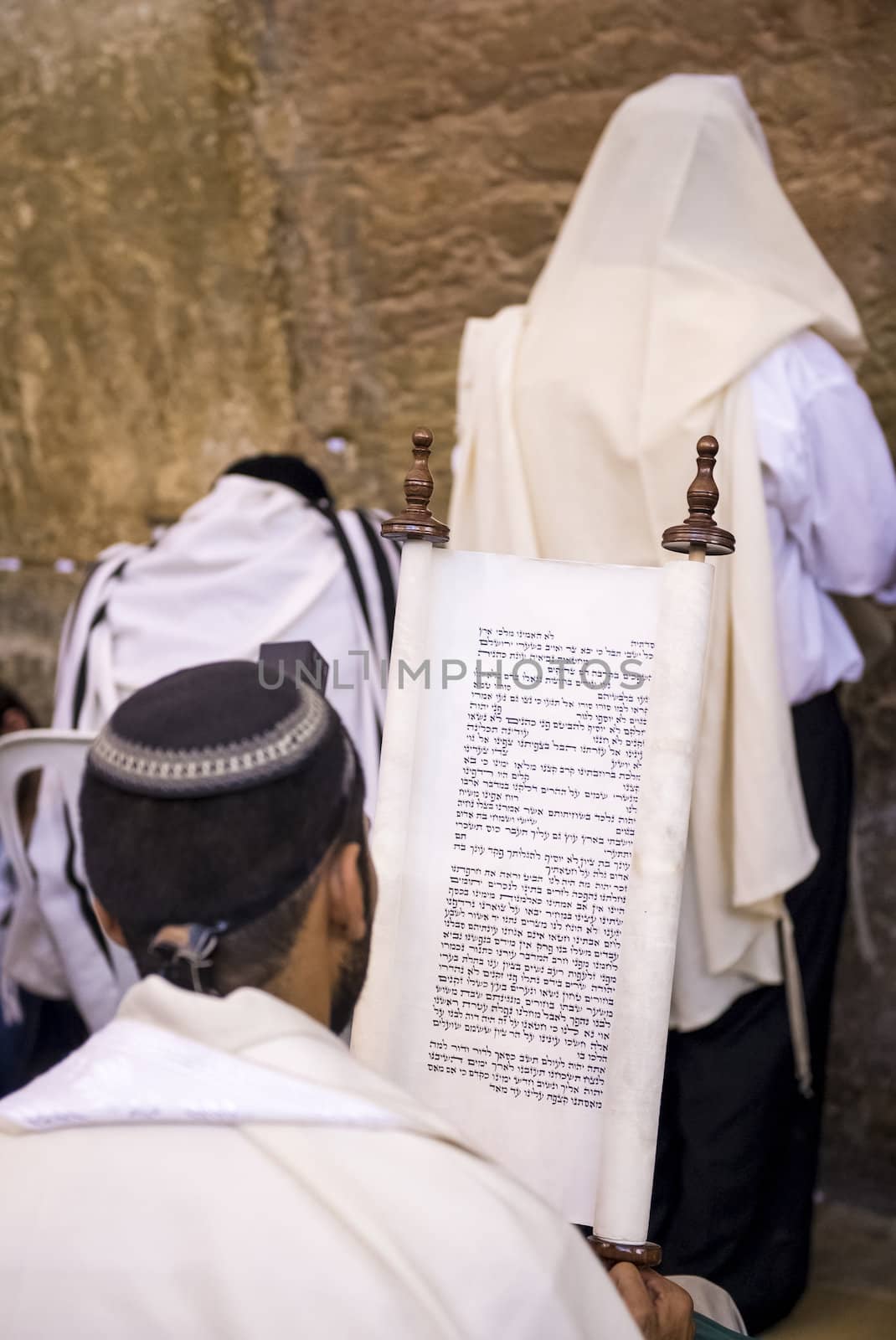 JERUSALEM - JULY 29 : Jewish men prays in the Wailing wall during the Jewish holyday of Tisha B'av , on July 29 2012 in old Jerusalem , Israel 