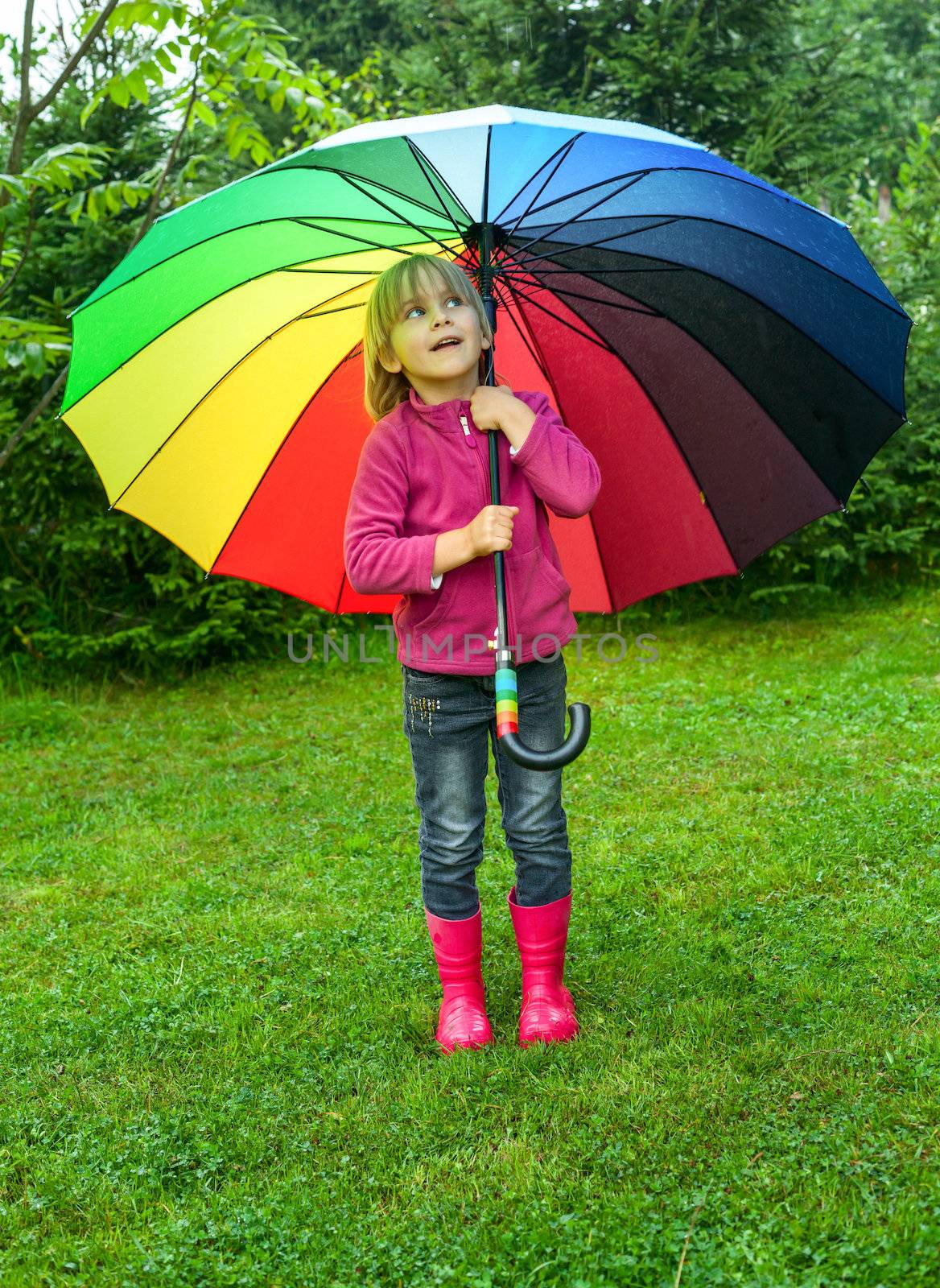 Child with umbrella outdoors by naumoid