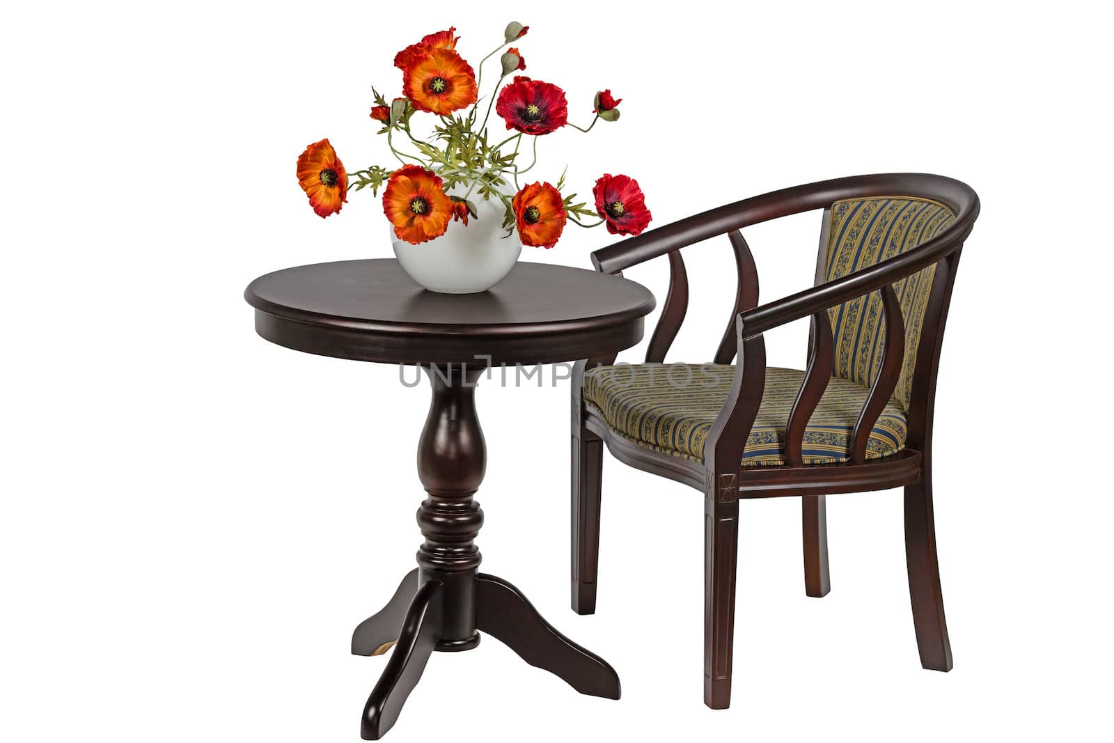 Bouquet of artificial poppies in a vase on the round table, isolated on white background
