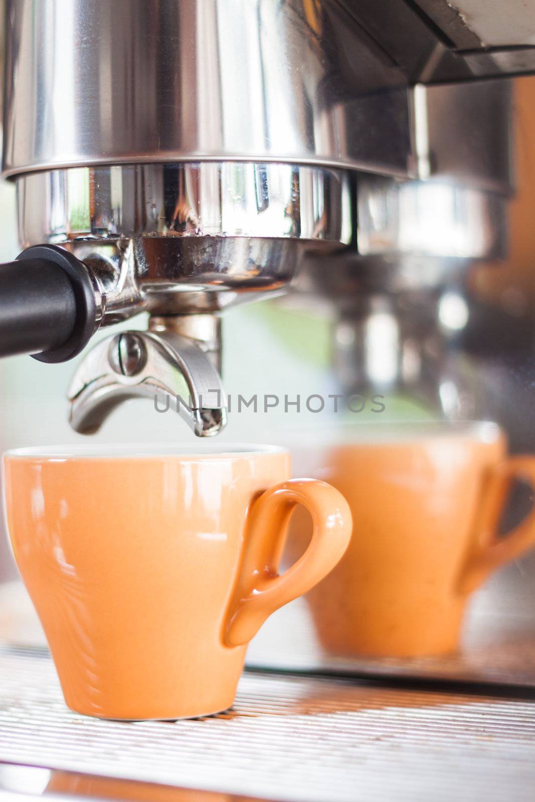 Orange cup of coffee for espresso, stock photo