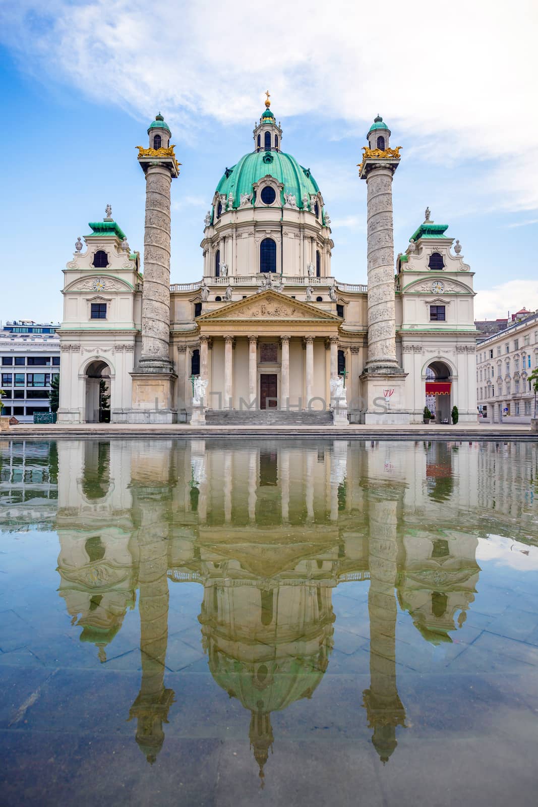 VIENNA, AUSTRIA - AUGUST 4, 2013: St. Charles's Church (Karlskirche) in Vienna with its refflection, Austria
