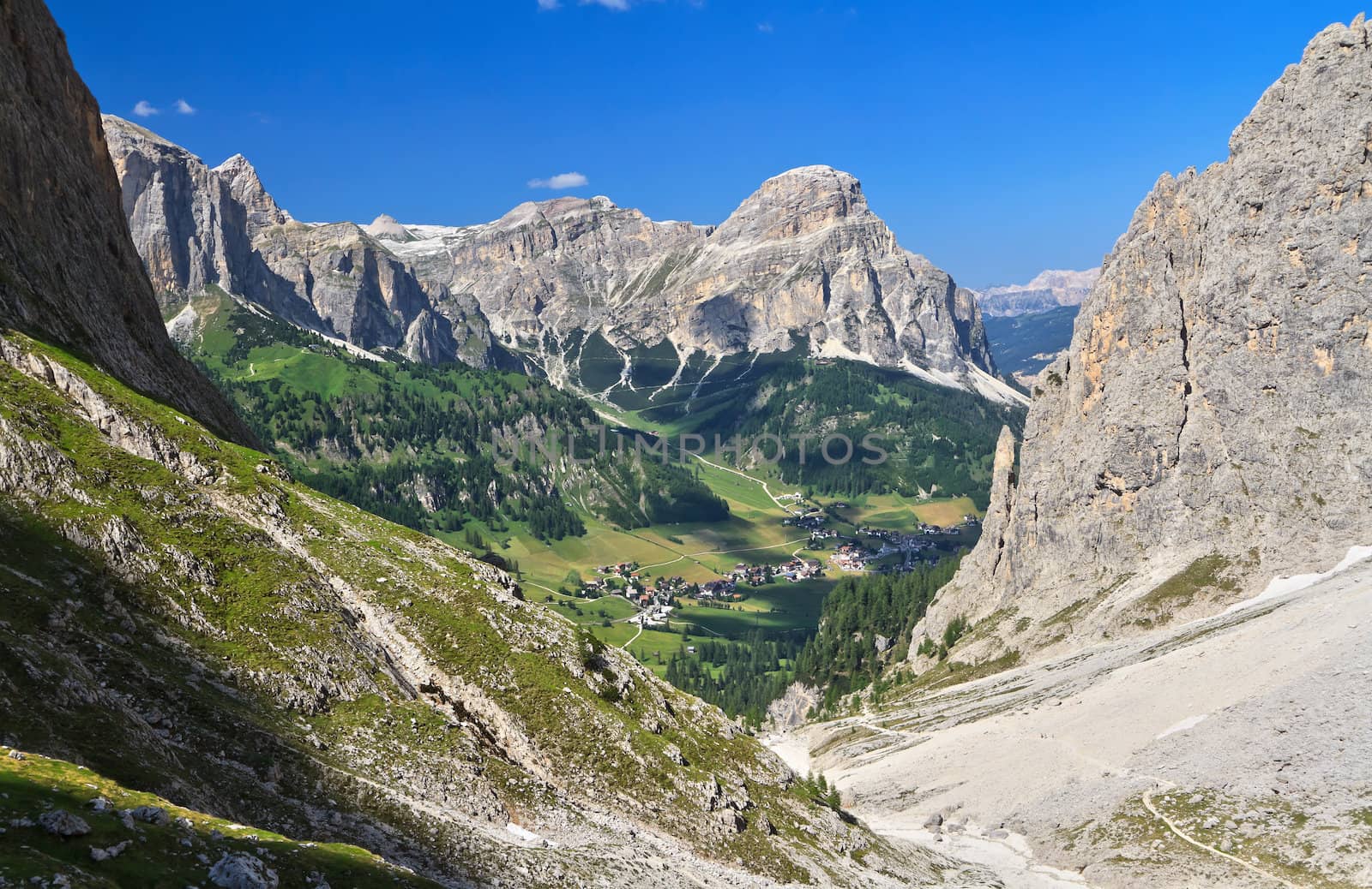 overview of Colfosco village in Badia Valley, on background Sassongher mount